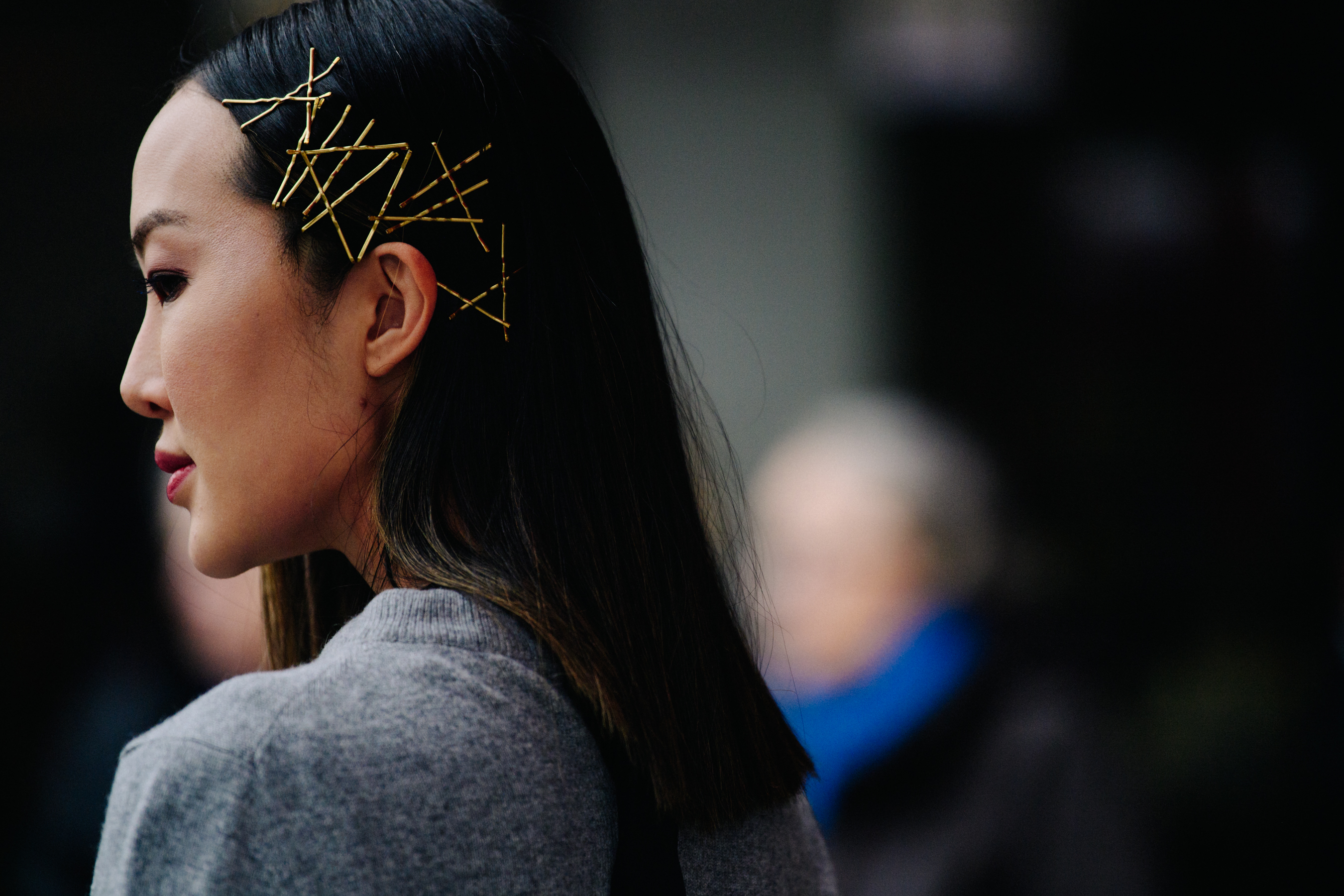 Asian woman wearing gold hair clips
