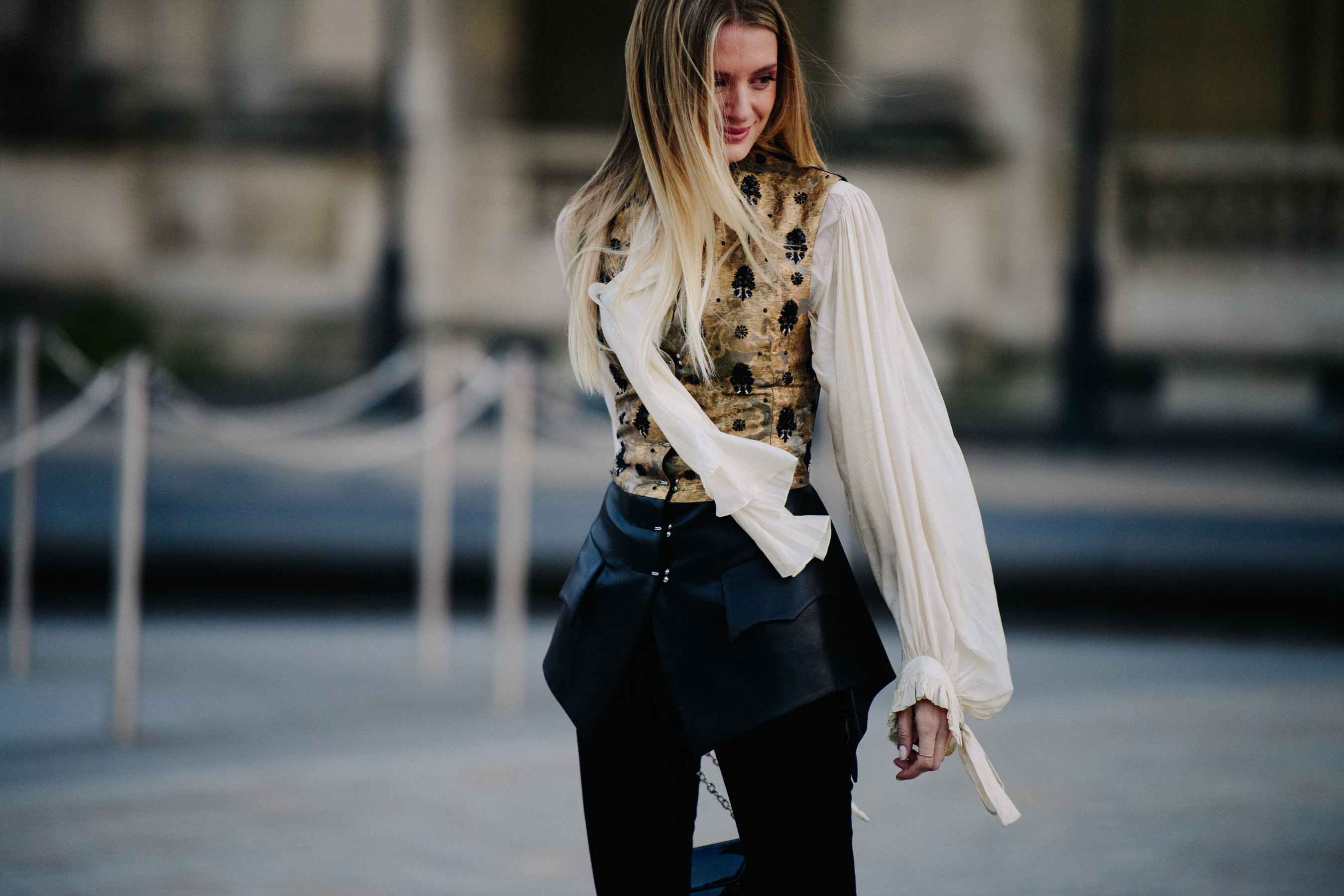 Woman wearing gold and black outfit