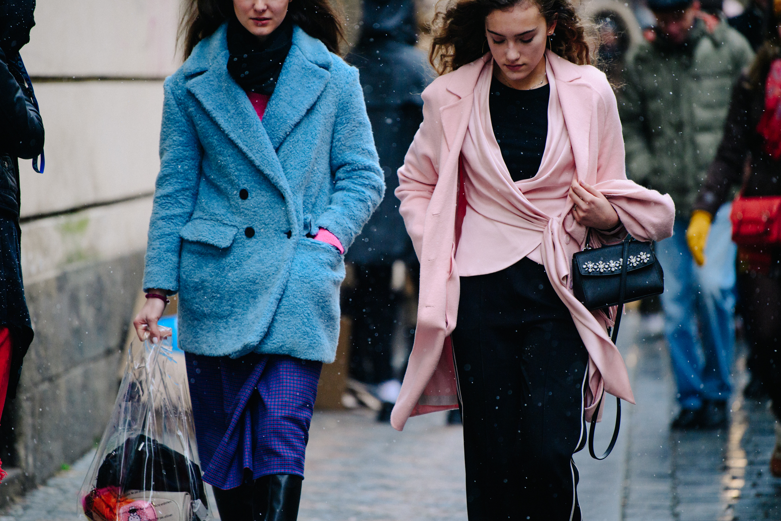 Two women wearing pink and blue