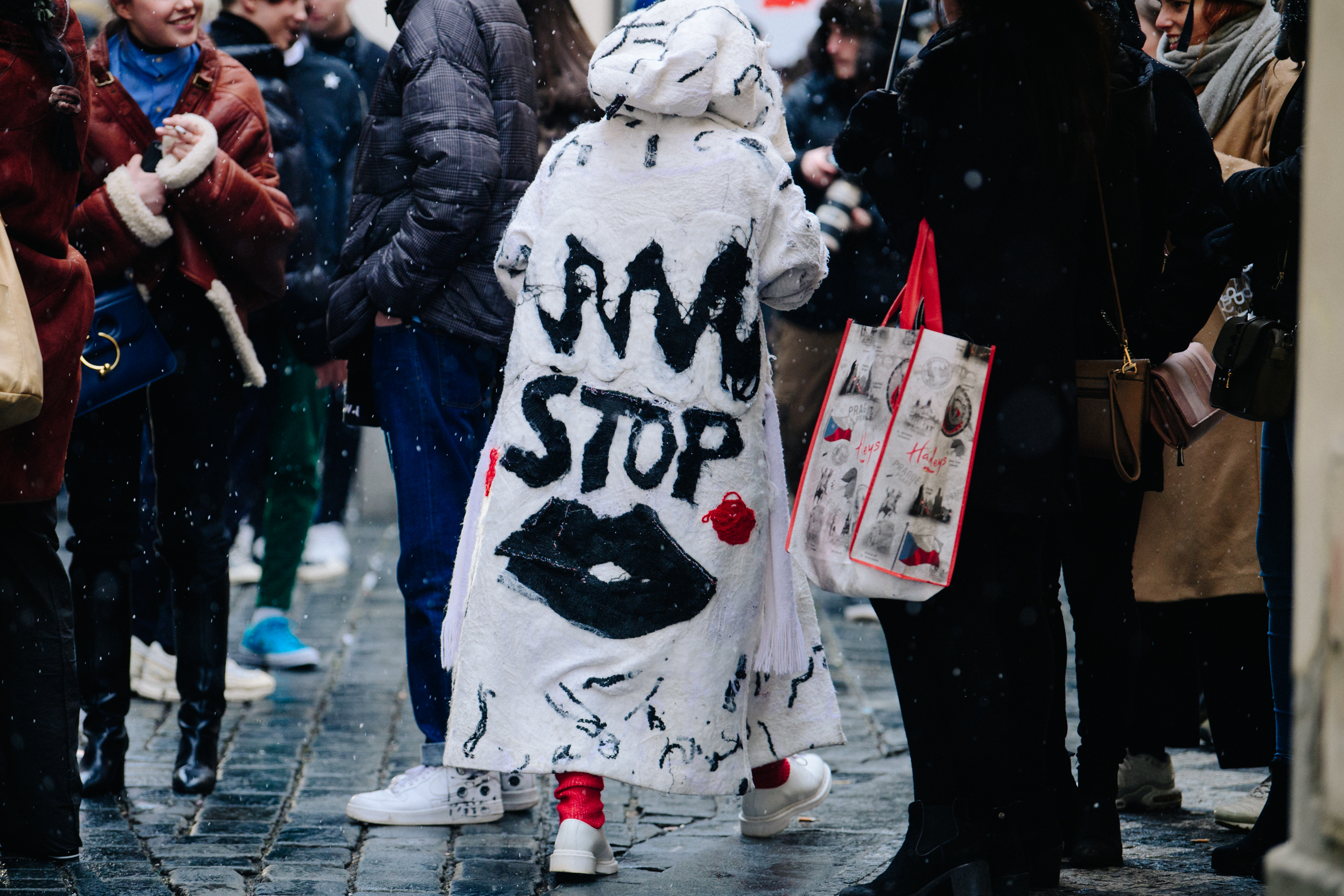 Woman wearing long white coat
