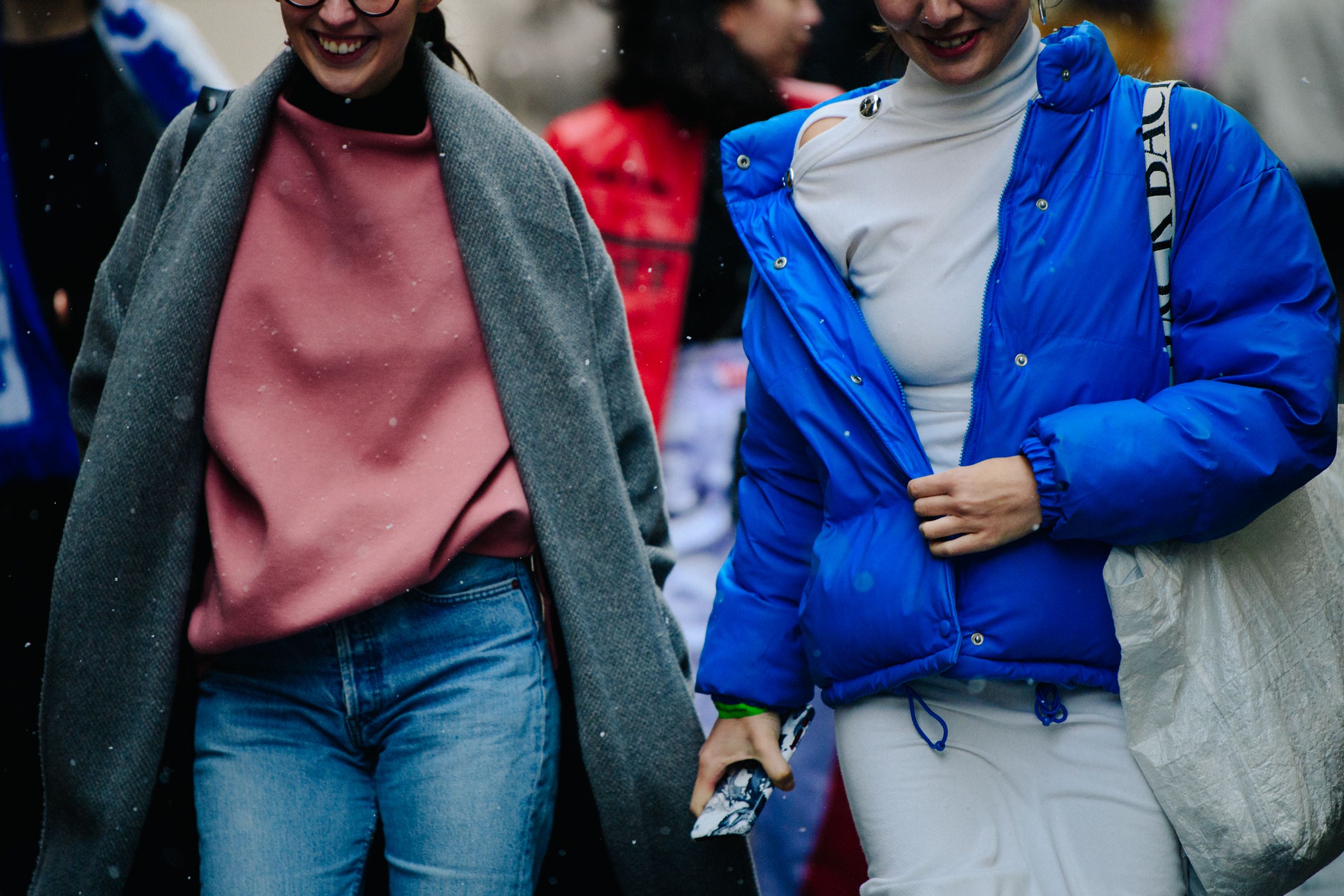Two women wearing pink and blue