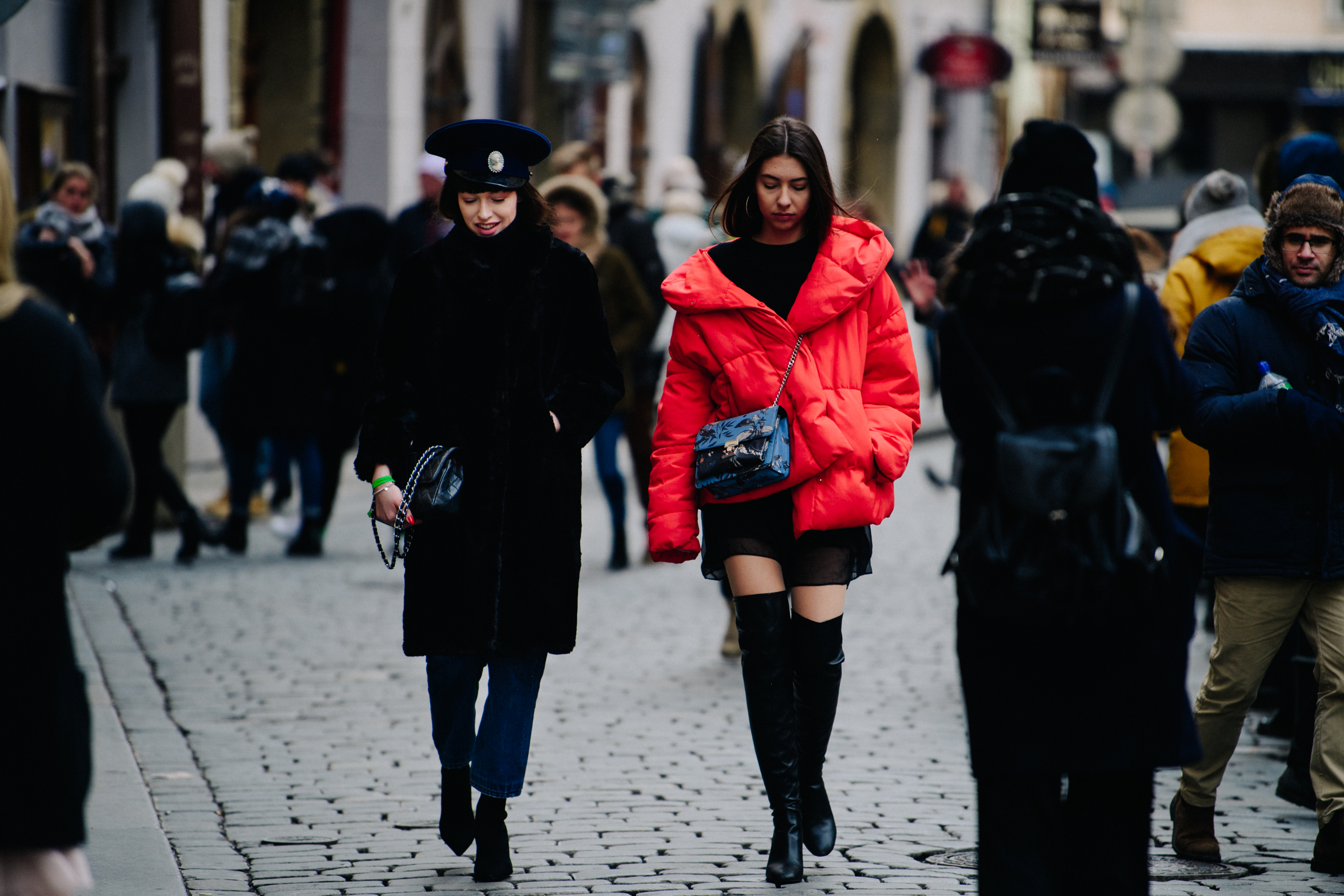 Two women wearing red and black
