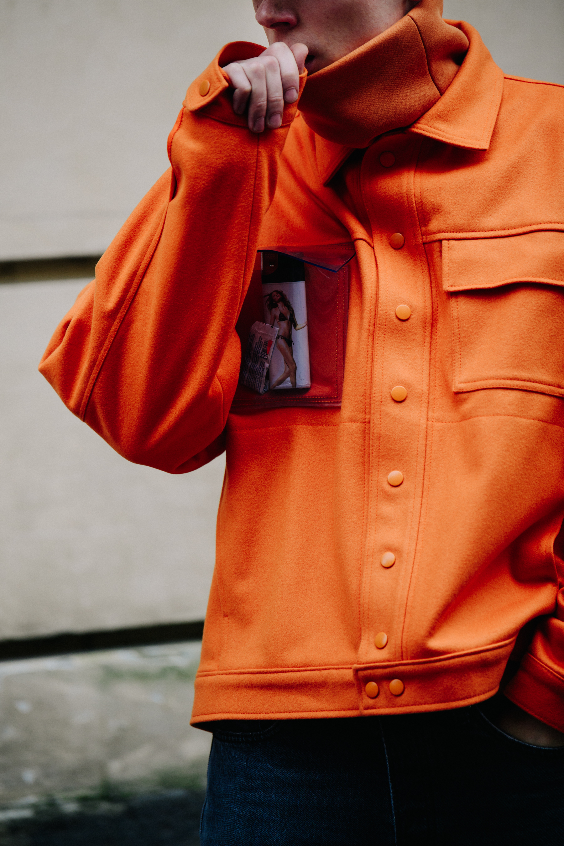 Man wearing orange jacket