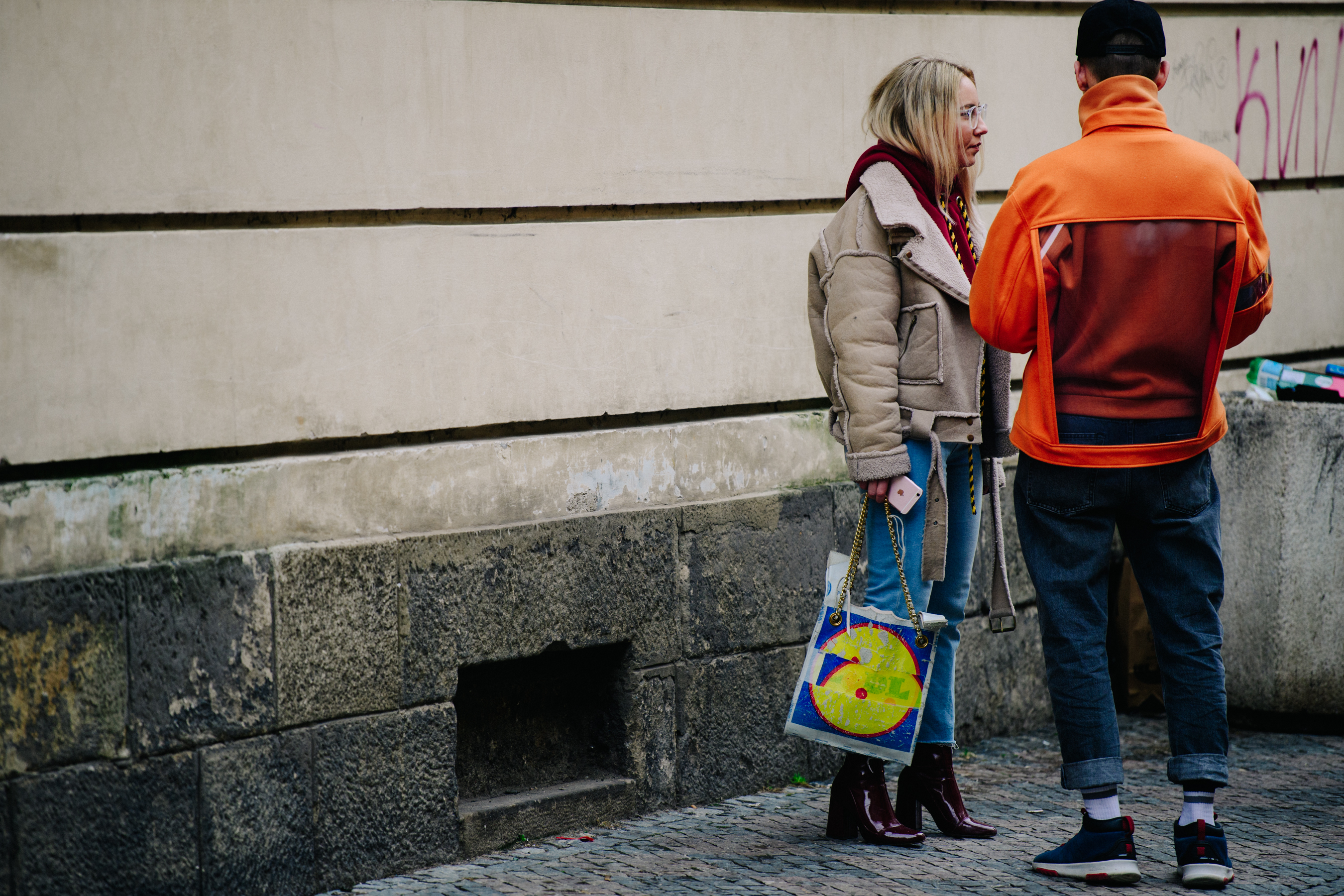 Couple wearing orange and red