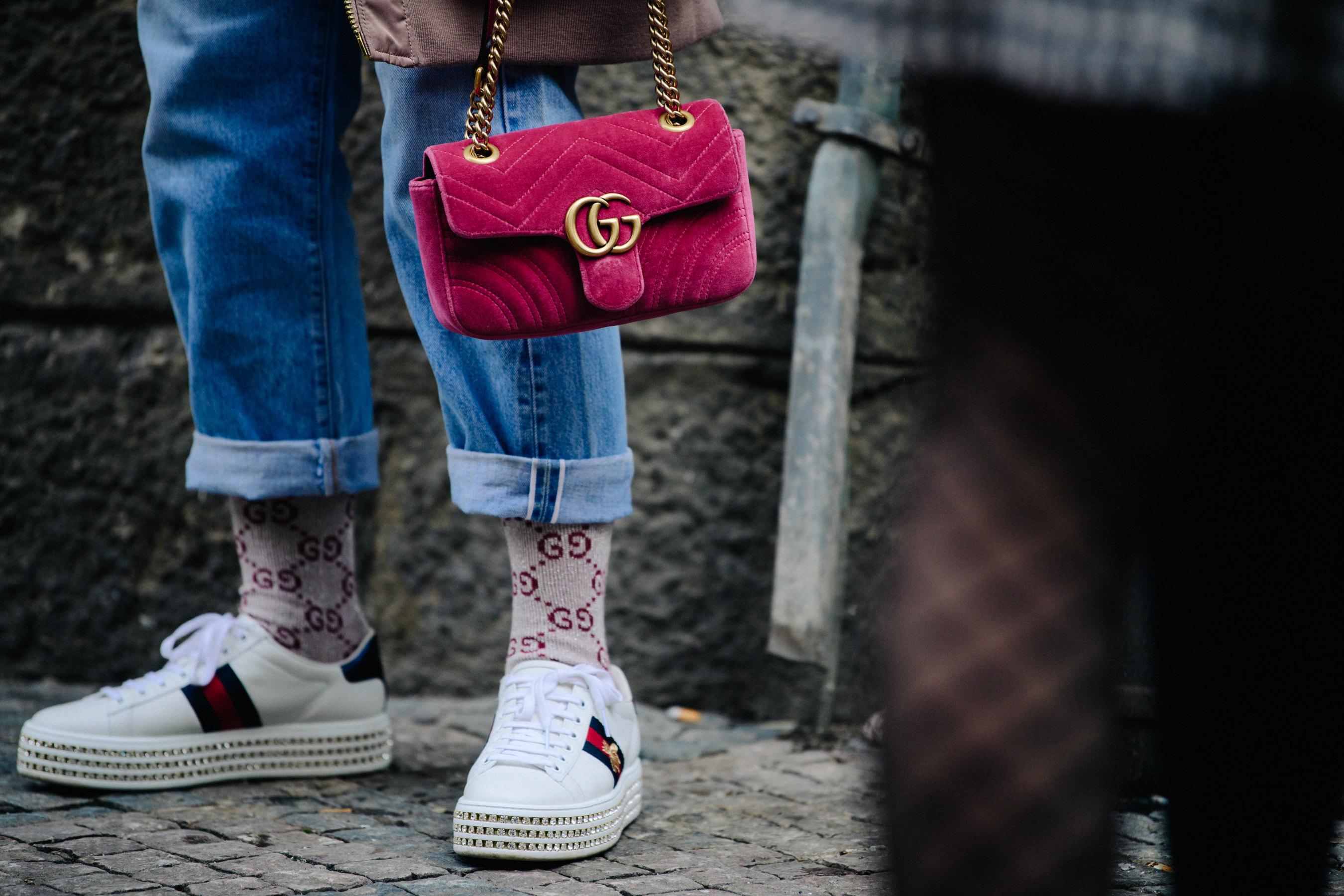 Woman wearing Gucci sneakers