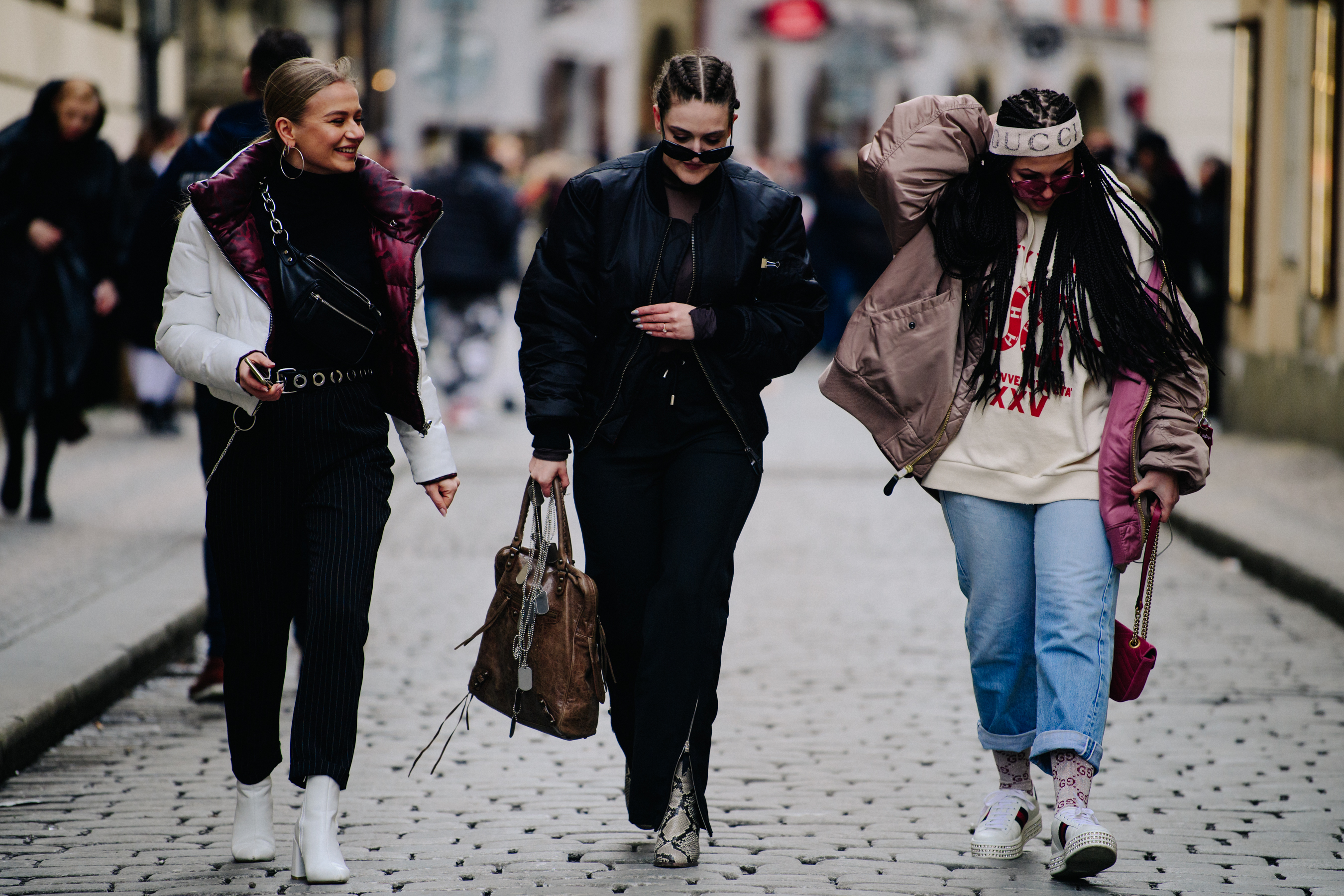 Three people wearing stylish clothing
