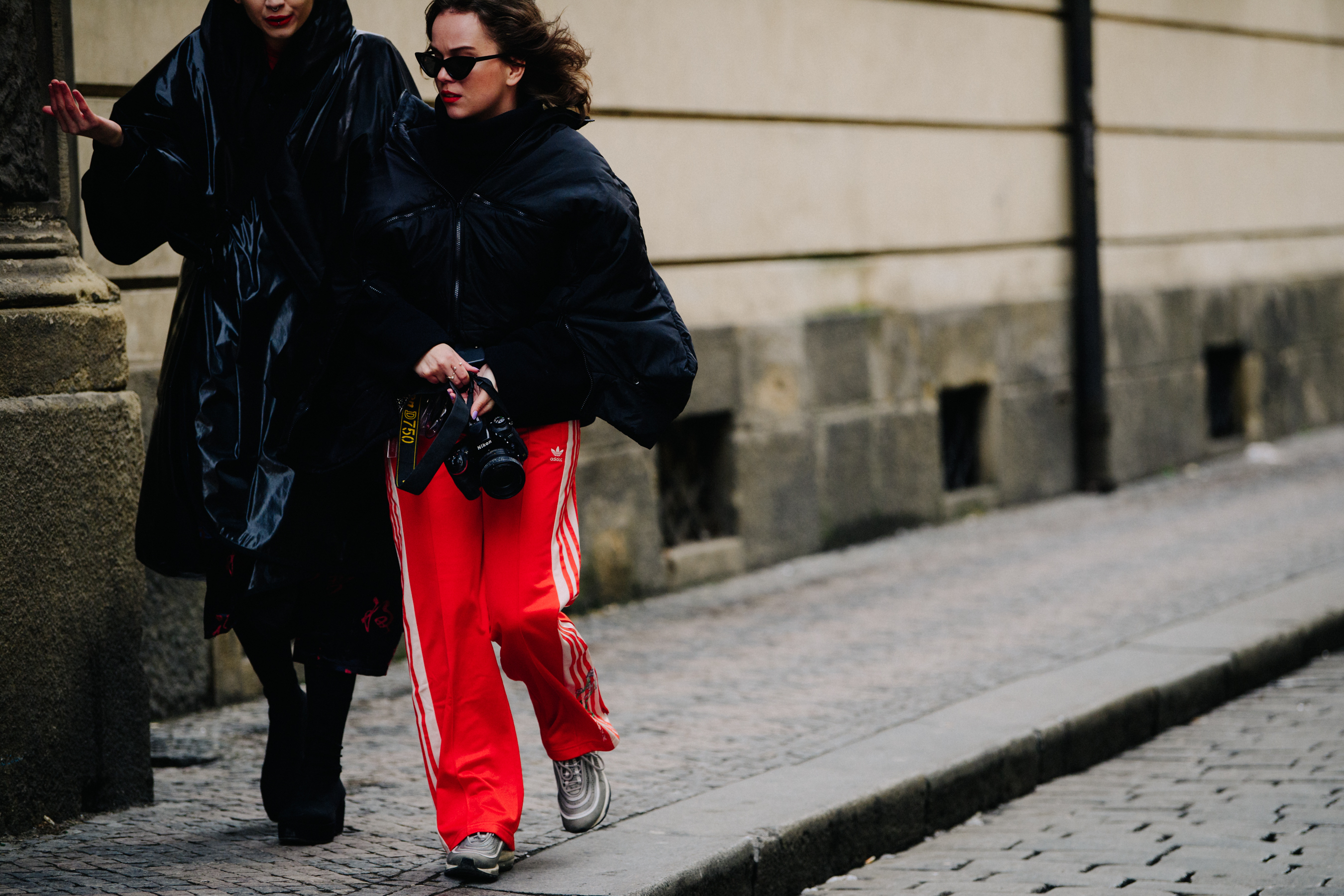 Two women wearing dark coats