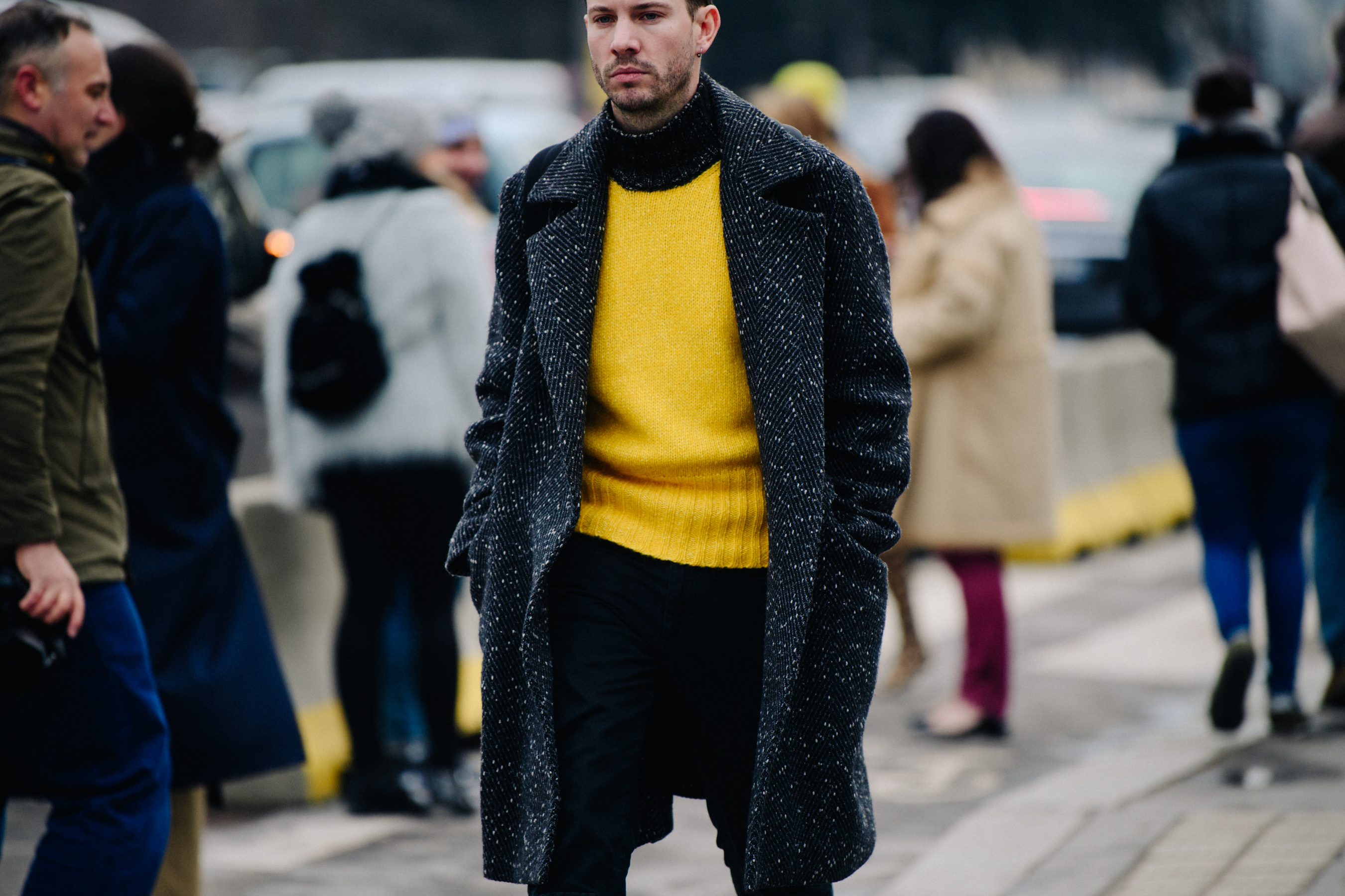 American man wearing yellow sweater