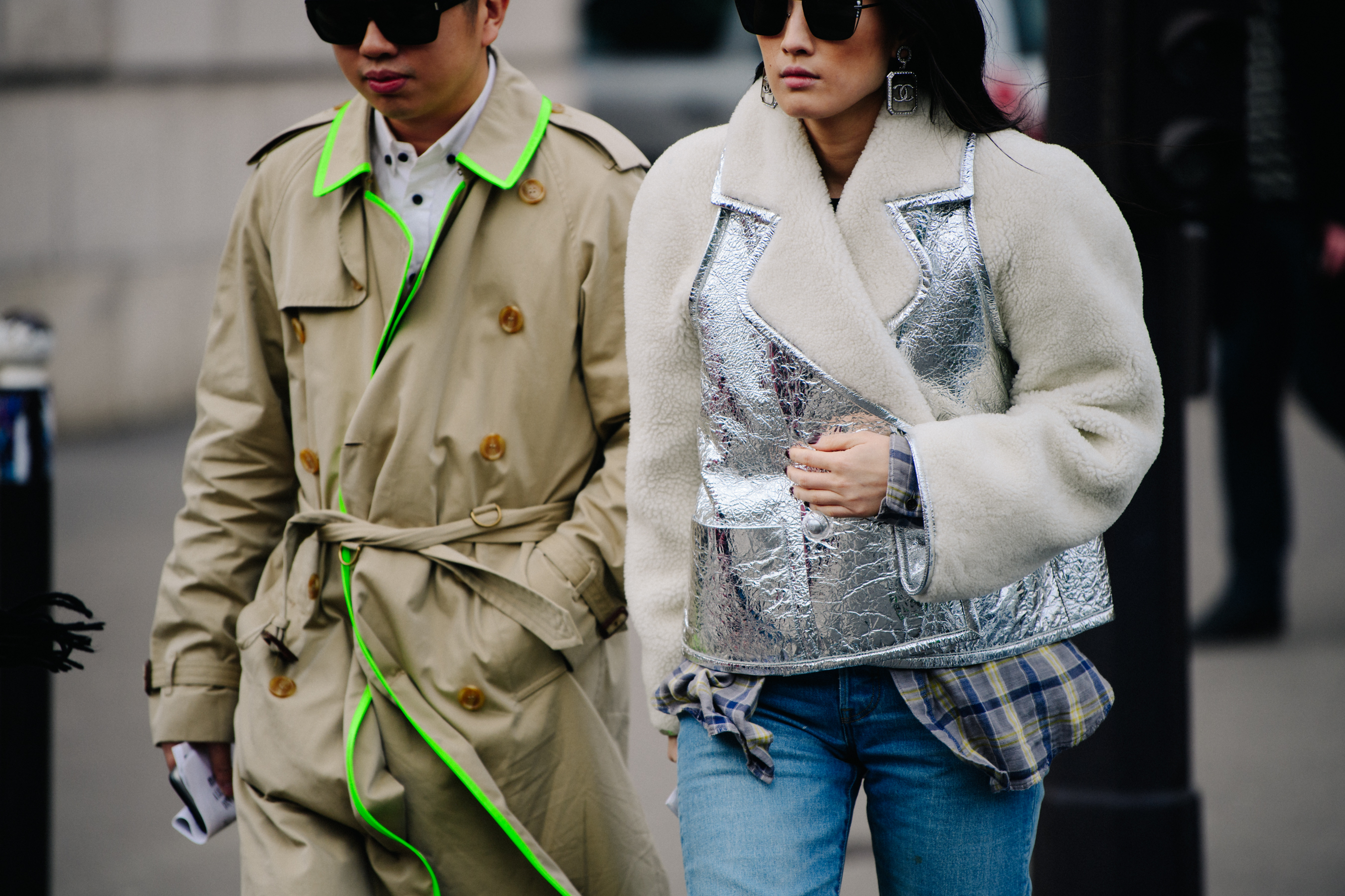 Asian couple wearing light jackets