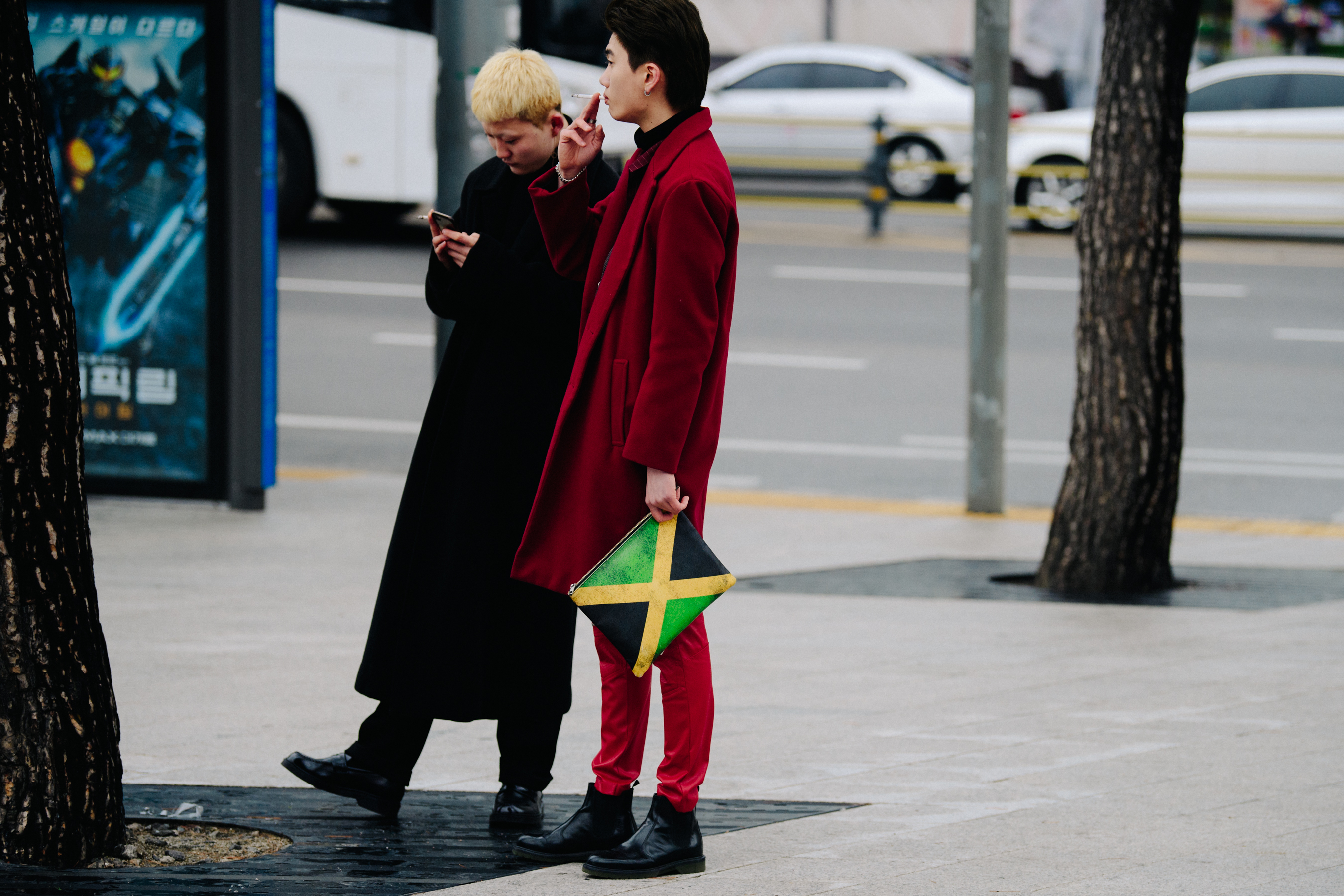 Two men wearing long coats