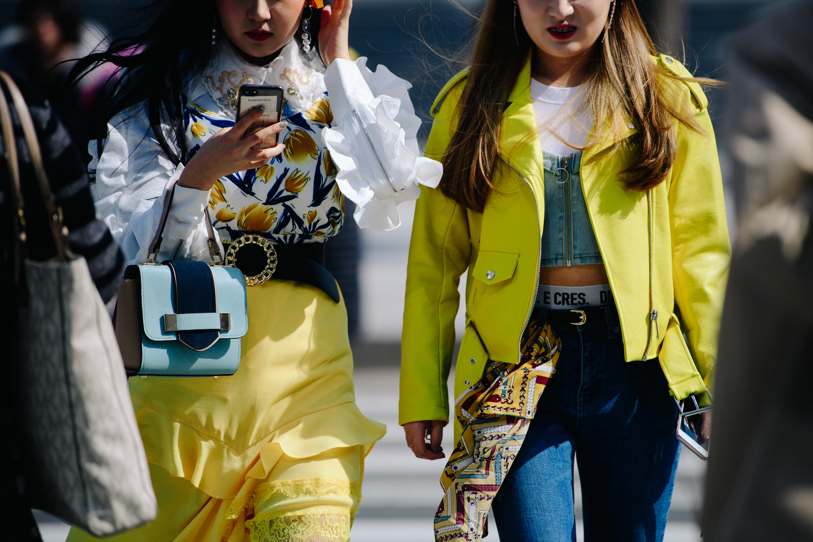 Two women wearing yellow