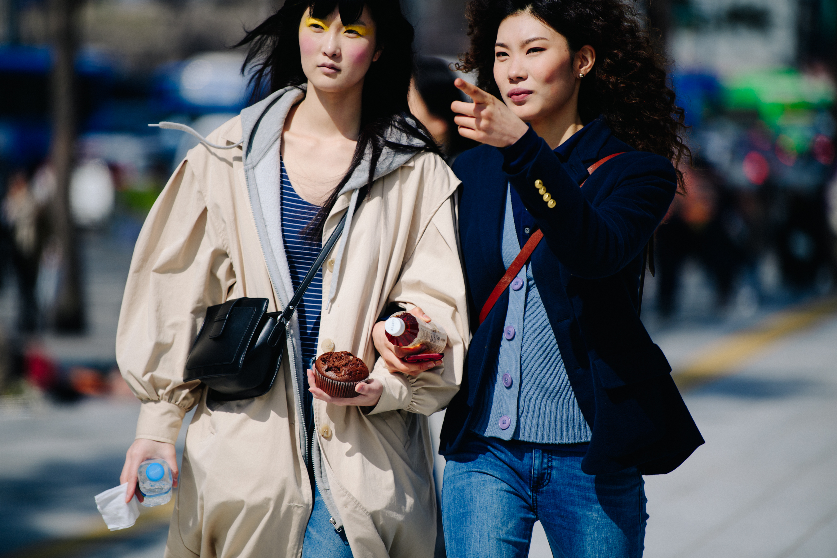 Two women wearing blue shirts