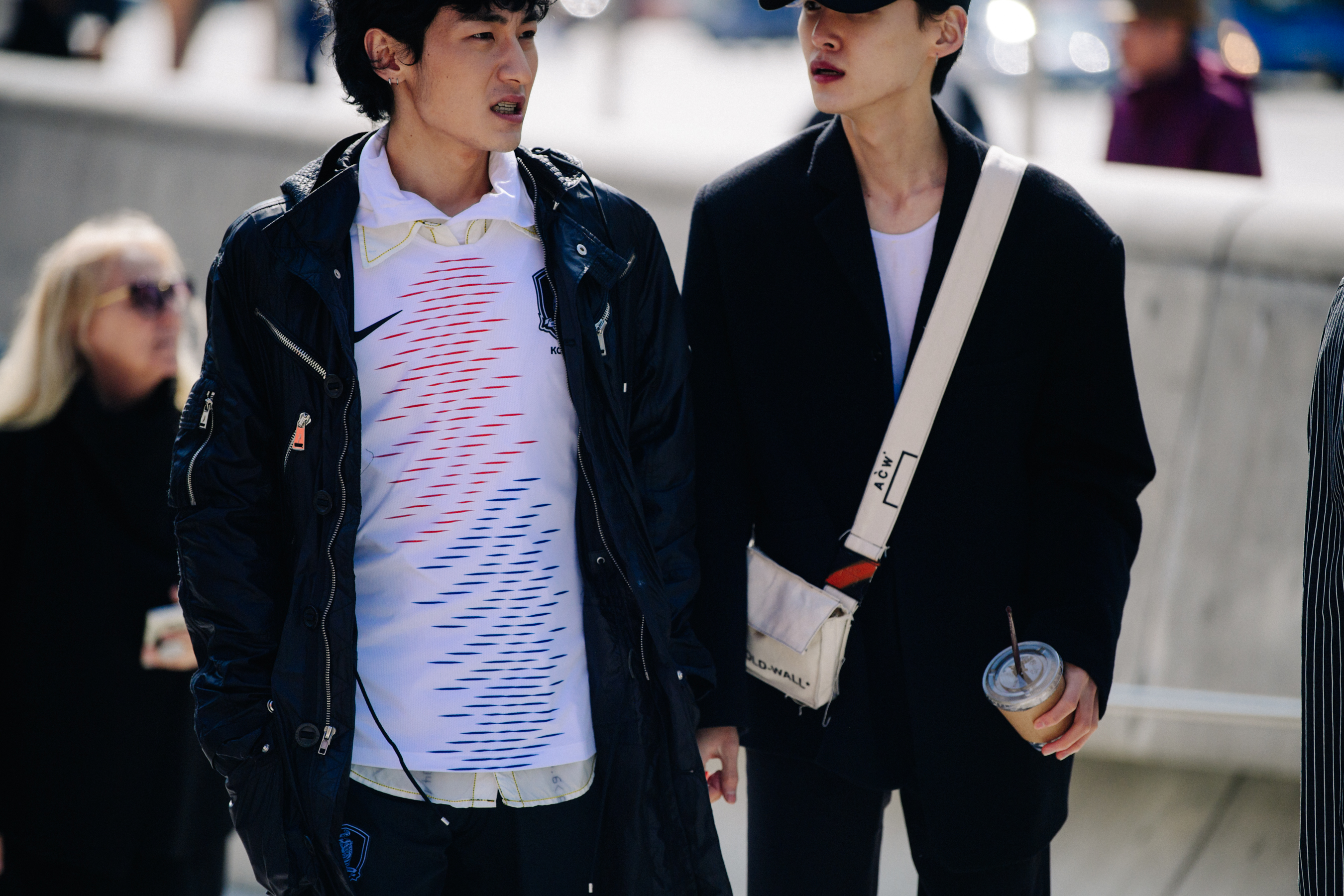 Two men wearing black jackets