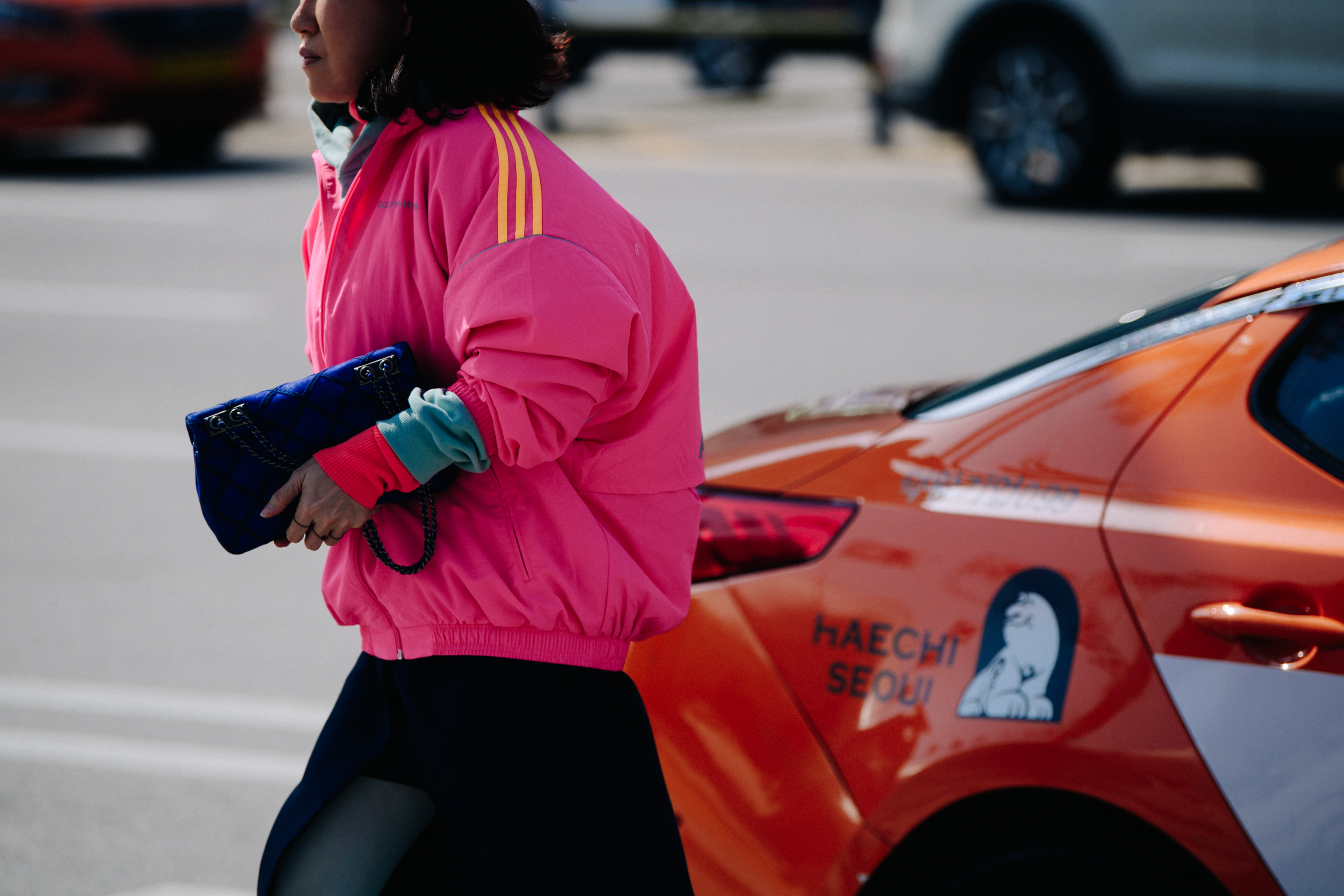 Asian woman wearing pink jacket