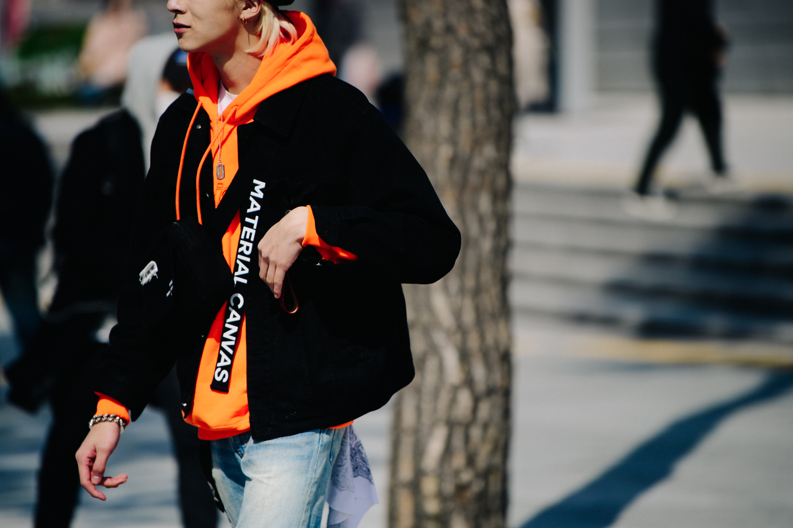 Man wearing orange hoodie