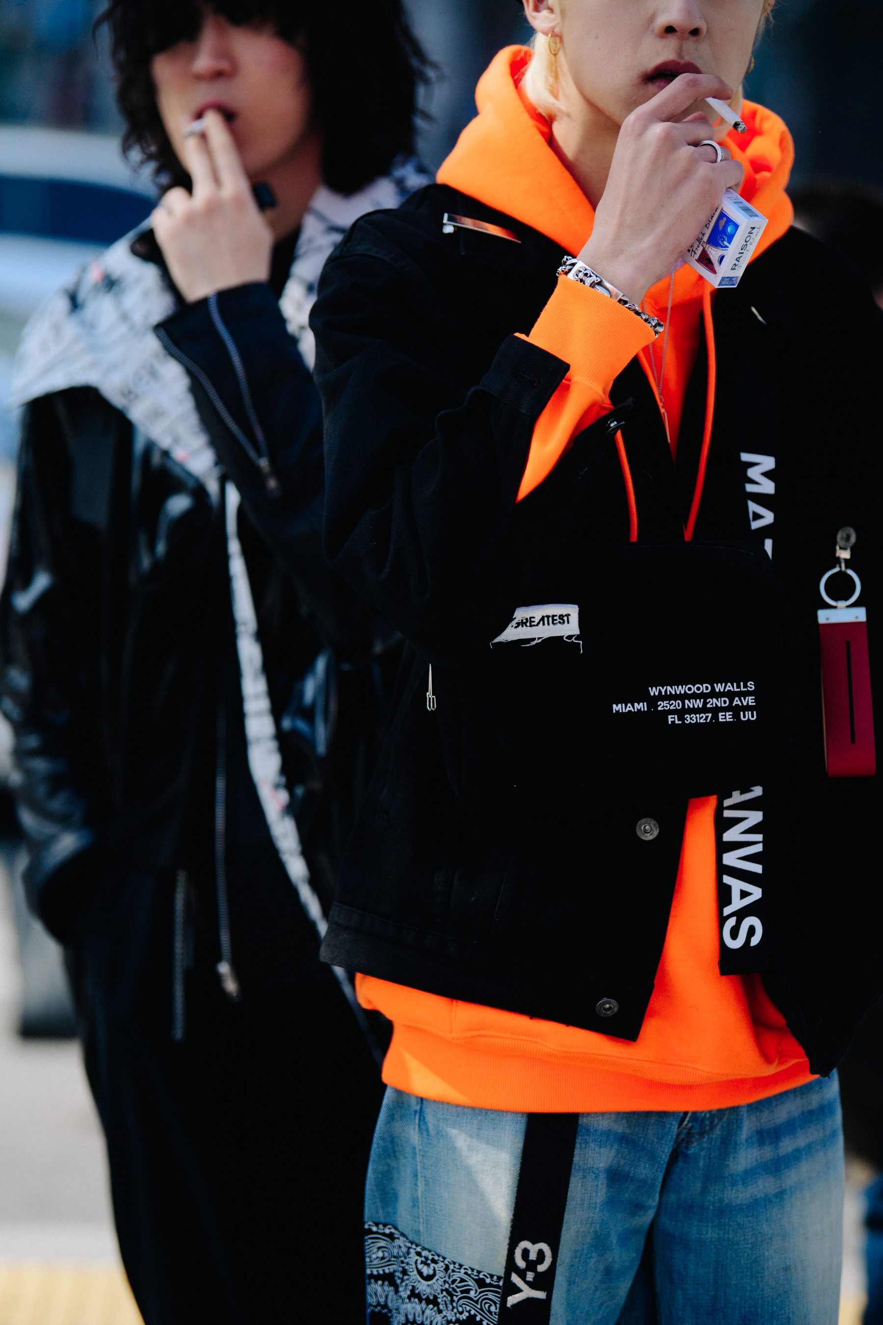 Man wearing orange hoodie