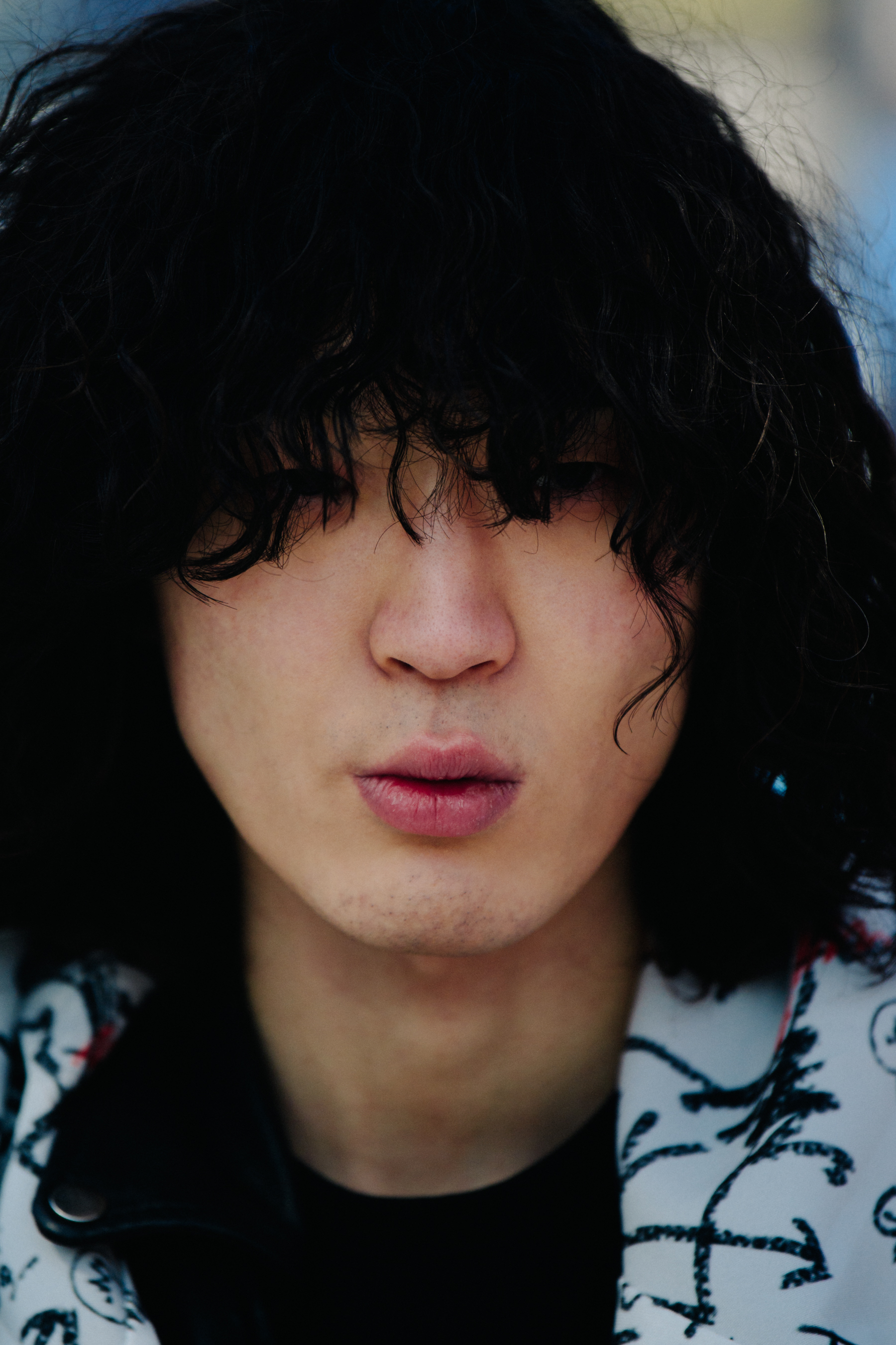 Portrait of man with long curly hair