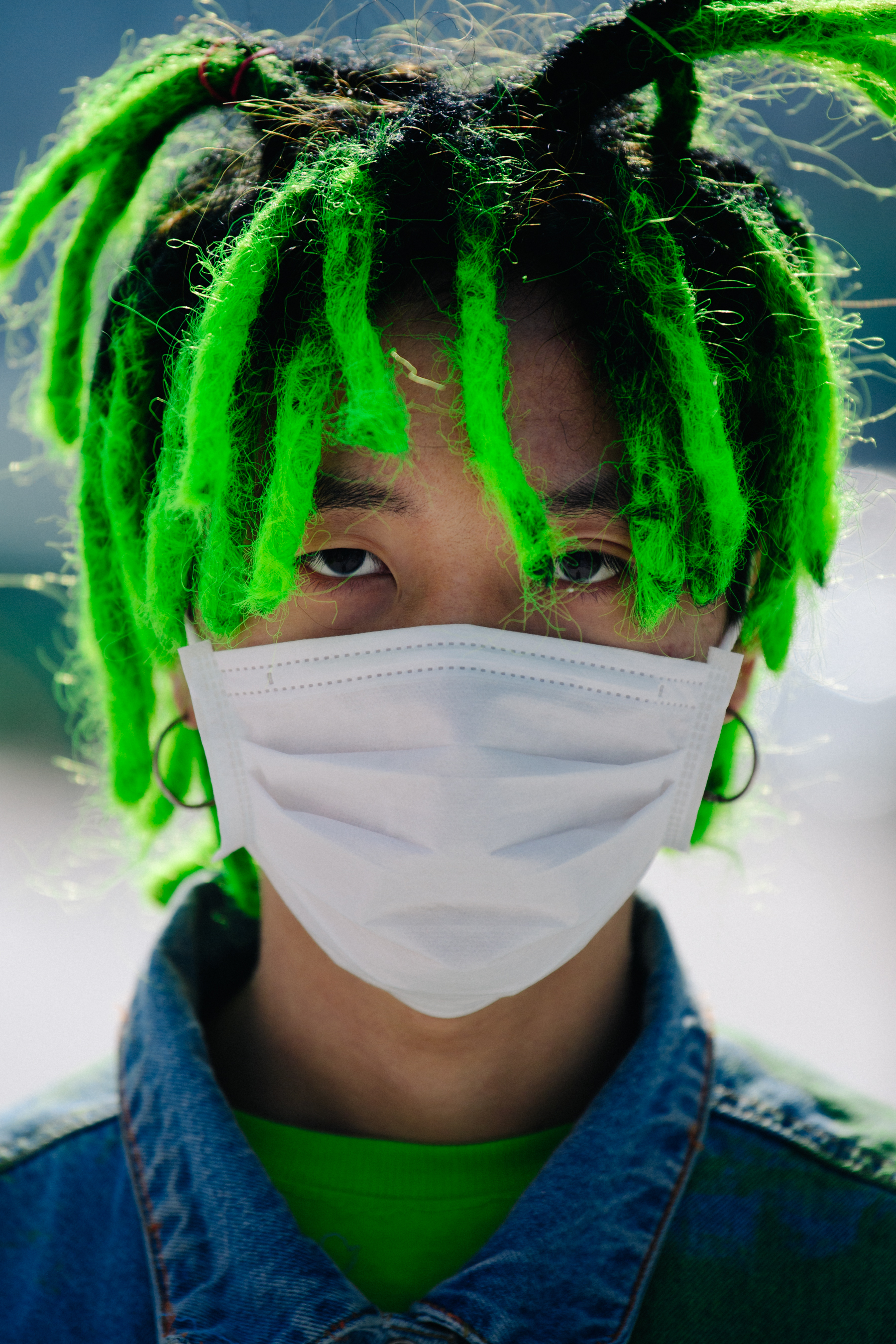 Portrait of man with green dreadlocks