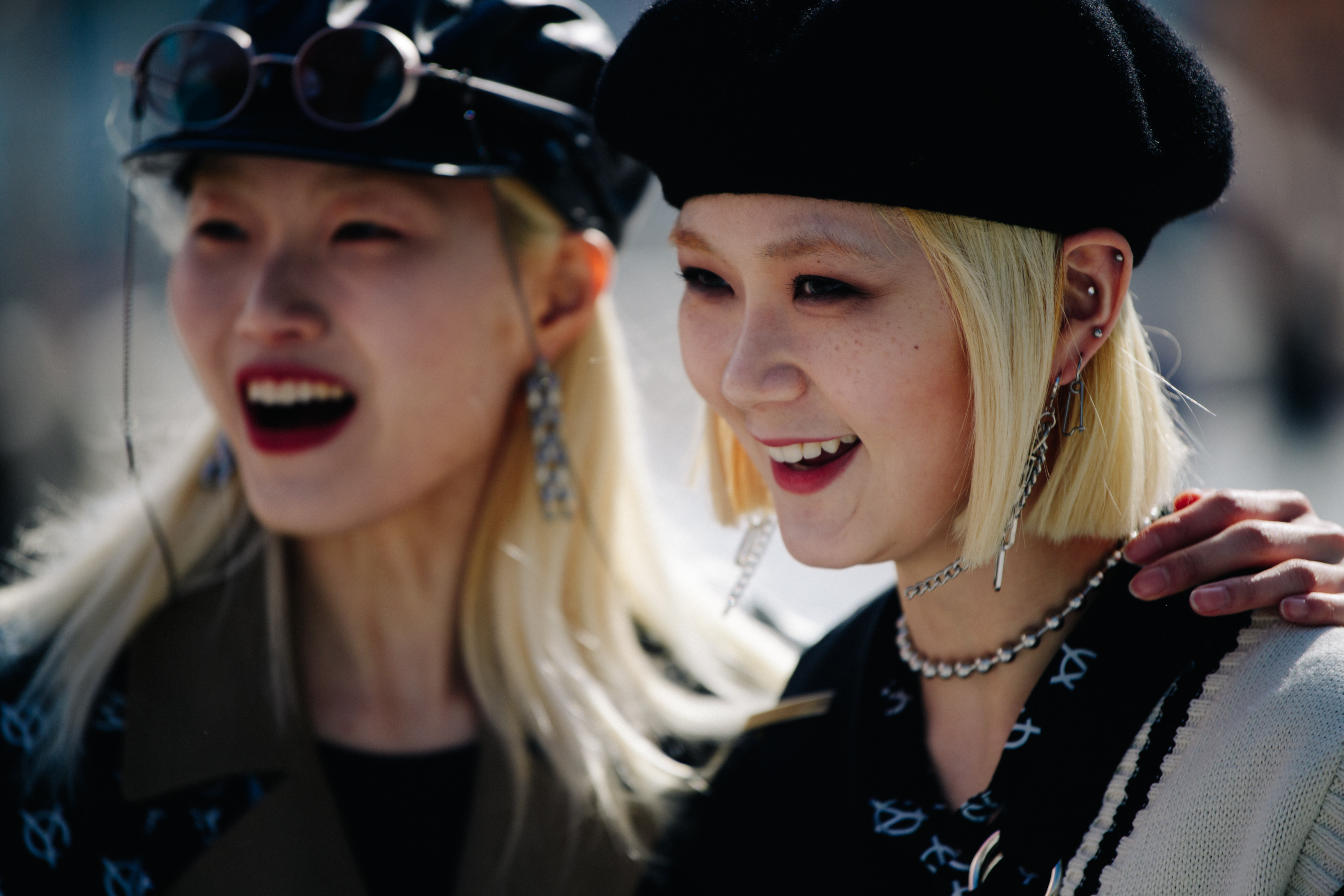 Two Asian girls wearing black hats