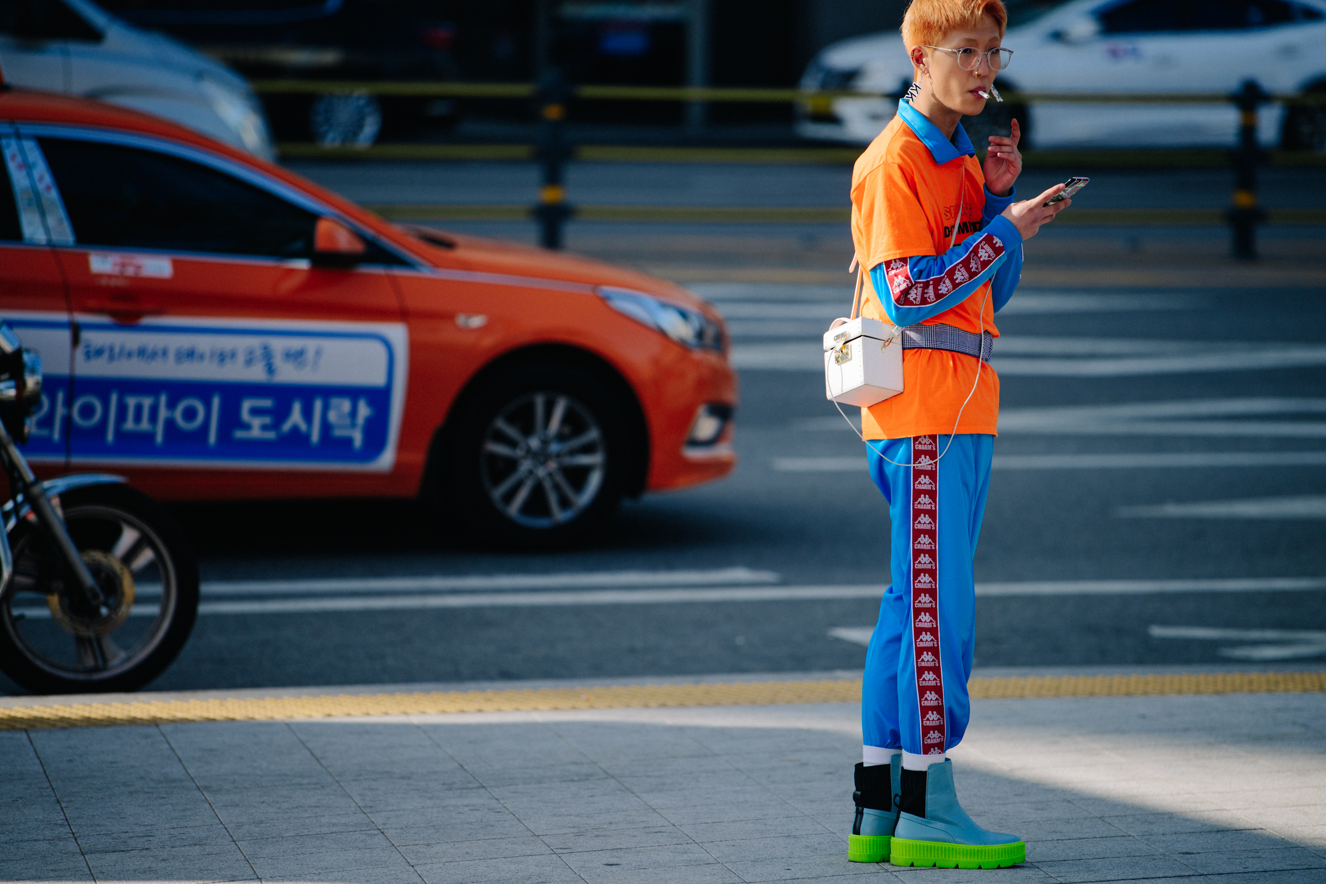 Woman wearing blue and orange outfit