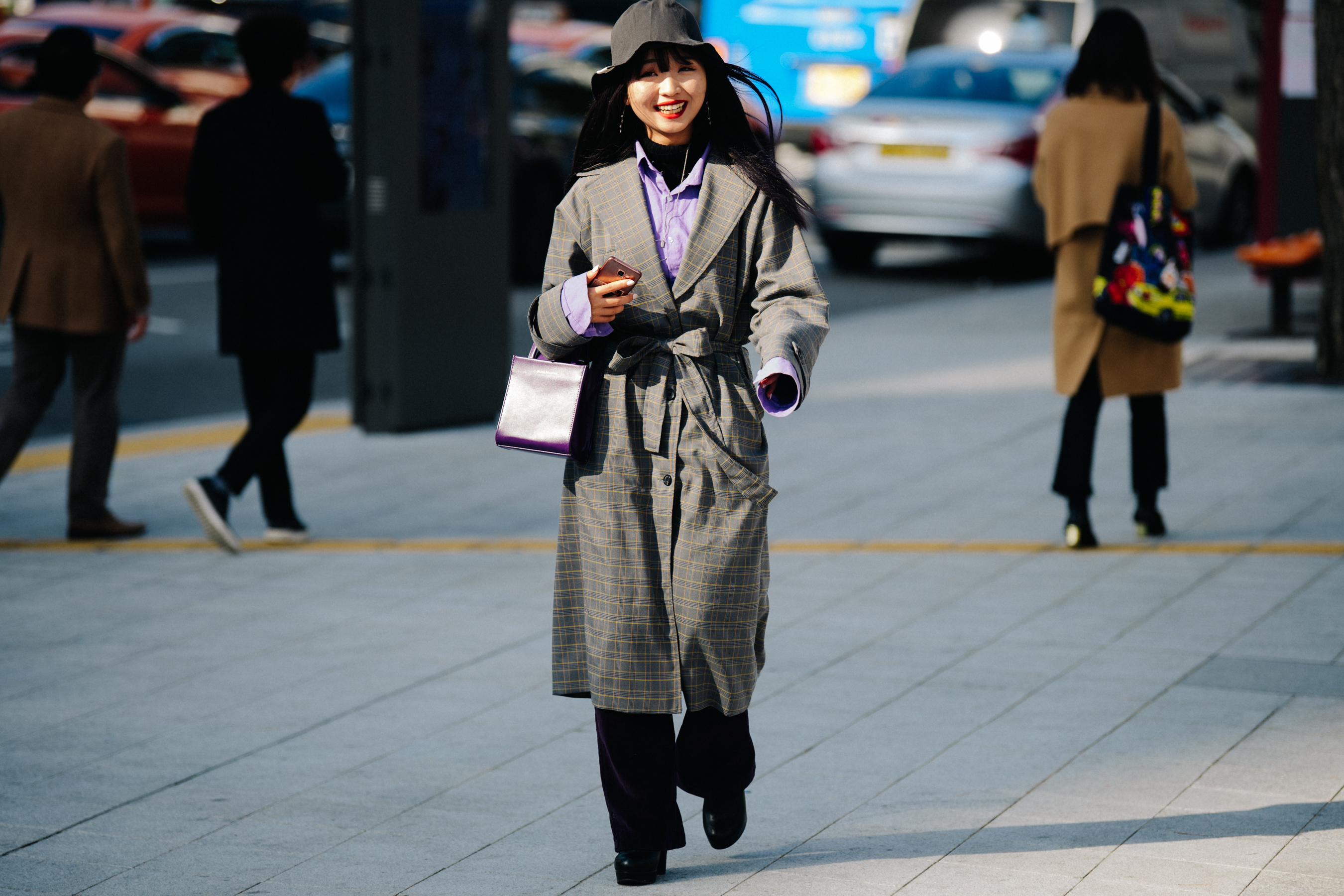 Woman wearing check coat