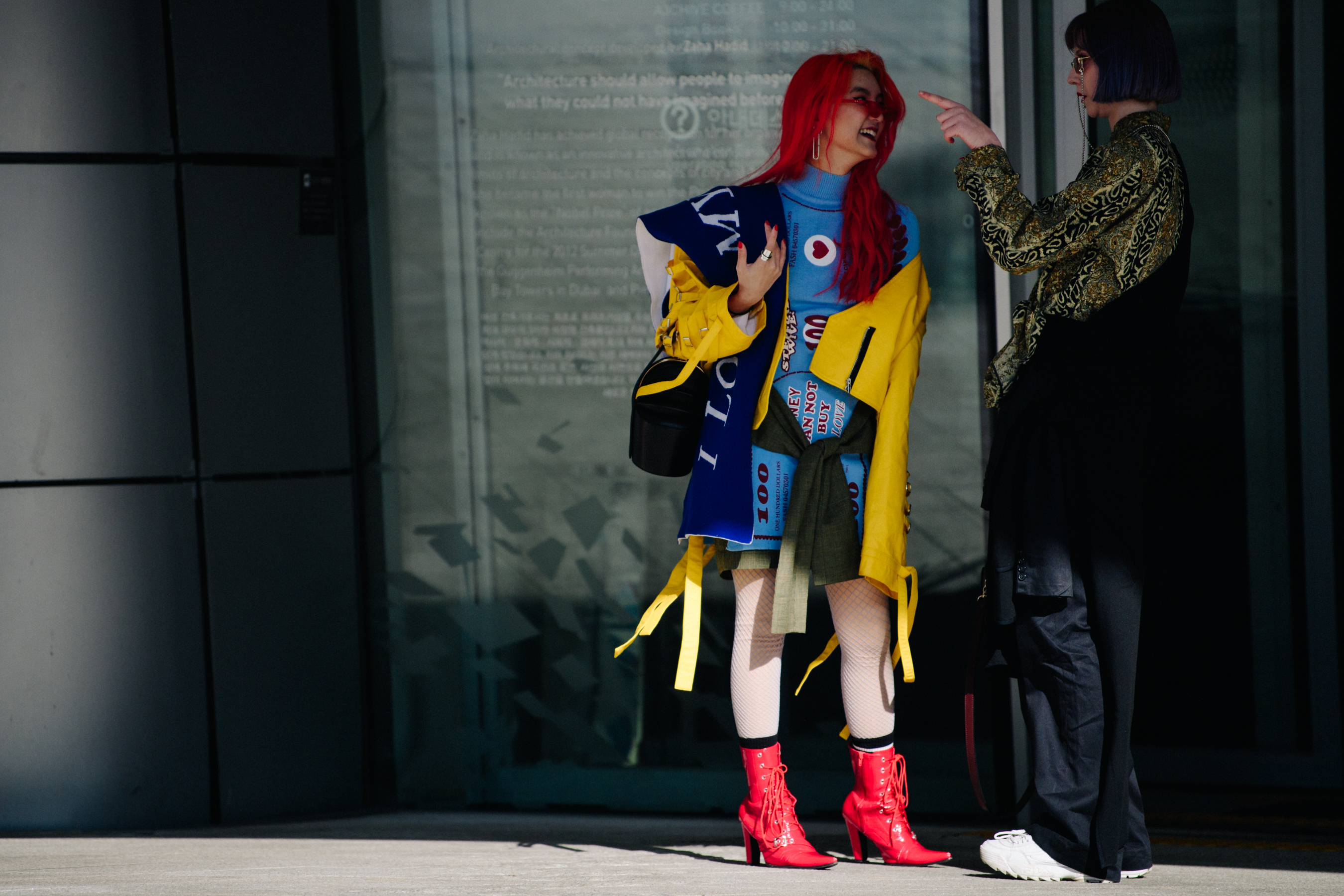Two women wearing pattern outfits