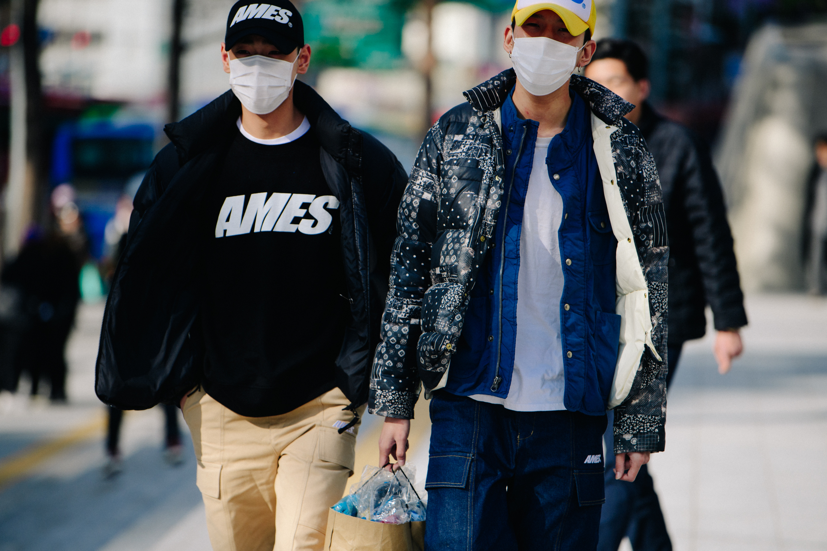 Two men wearing matching caps