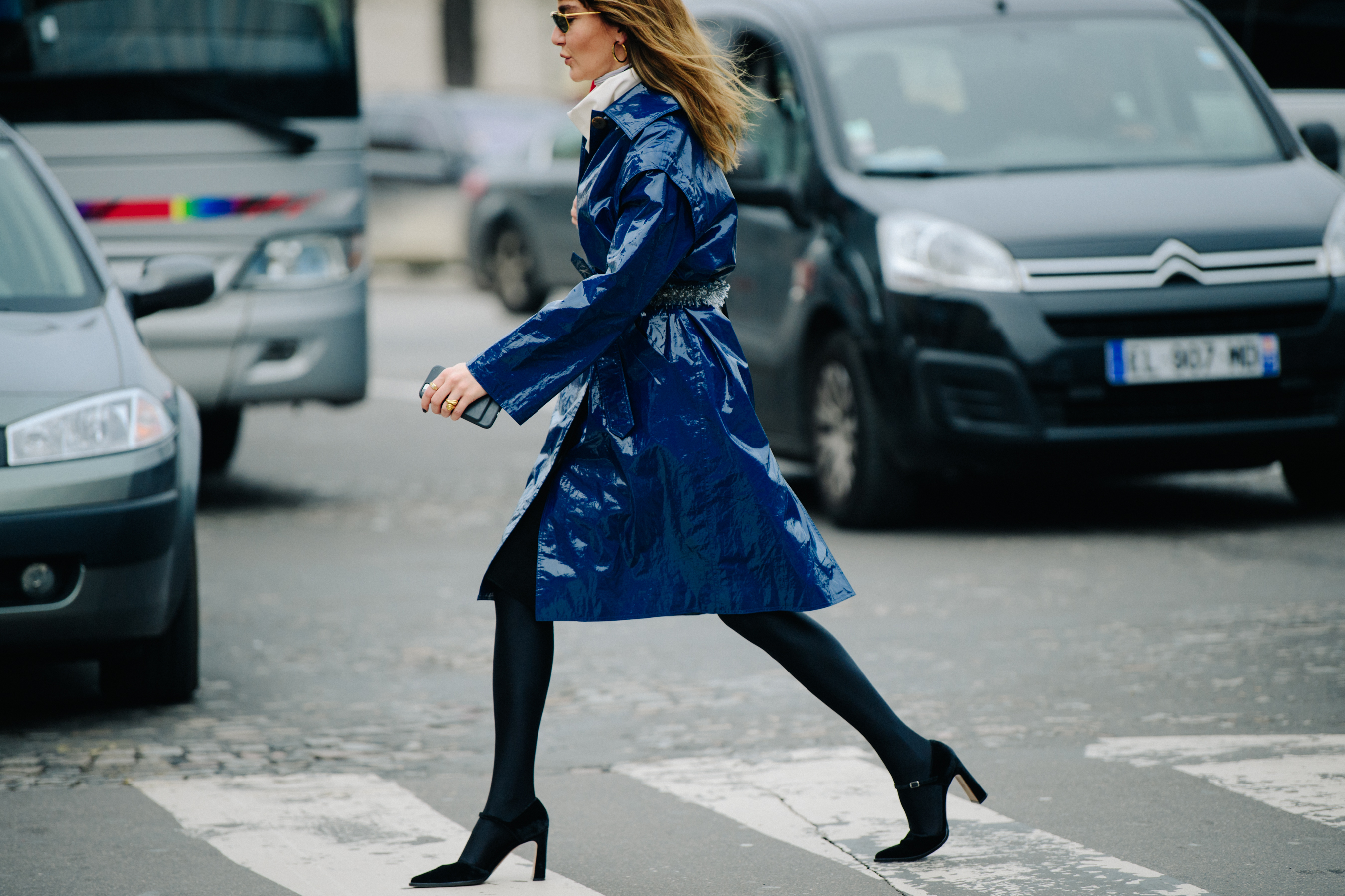 Woman wearing blue patent coat