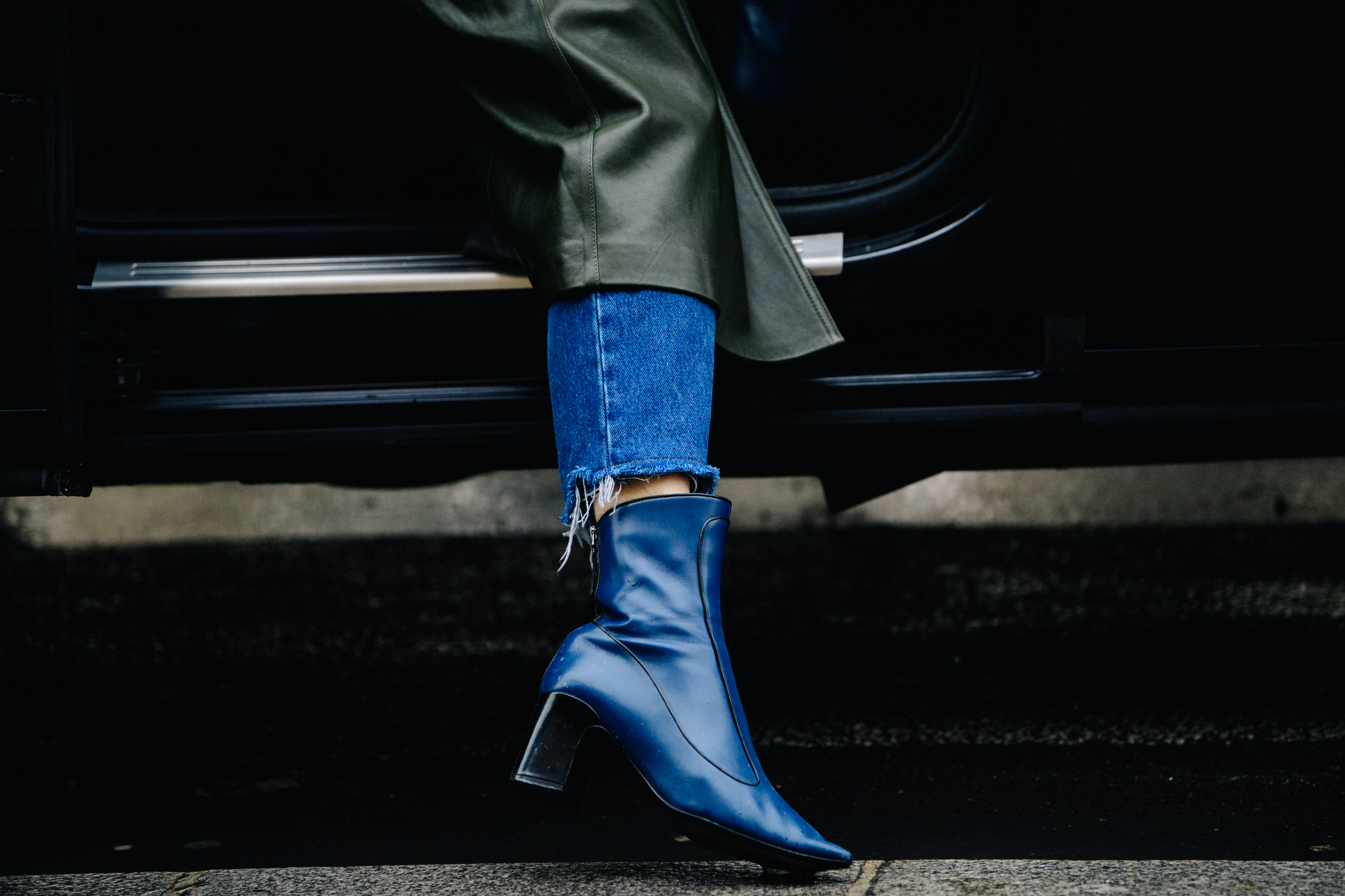 Woman wearing blue leather heels