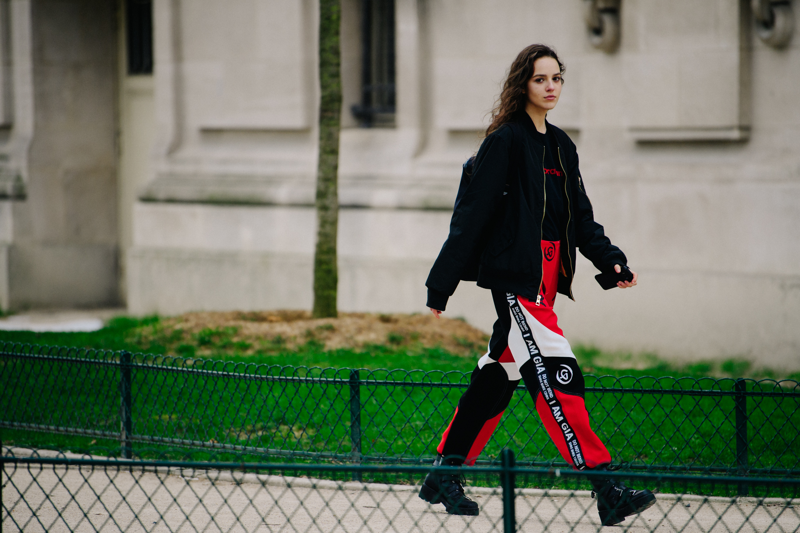 Model wearing red and black pants