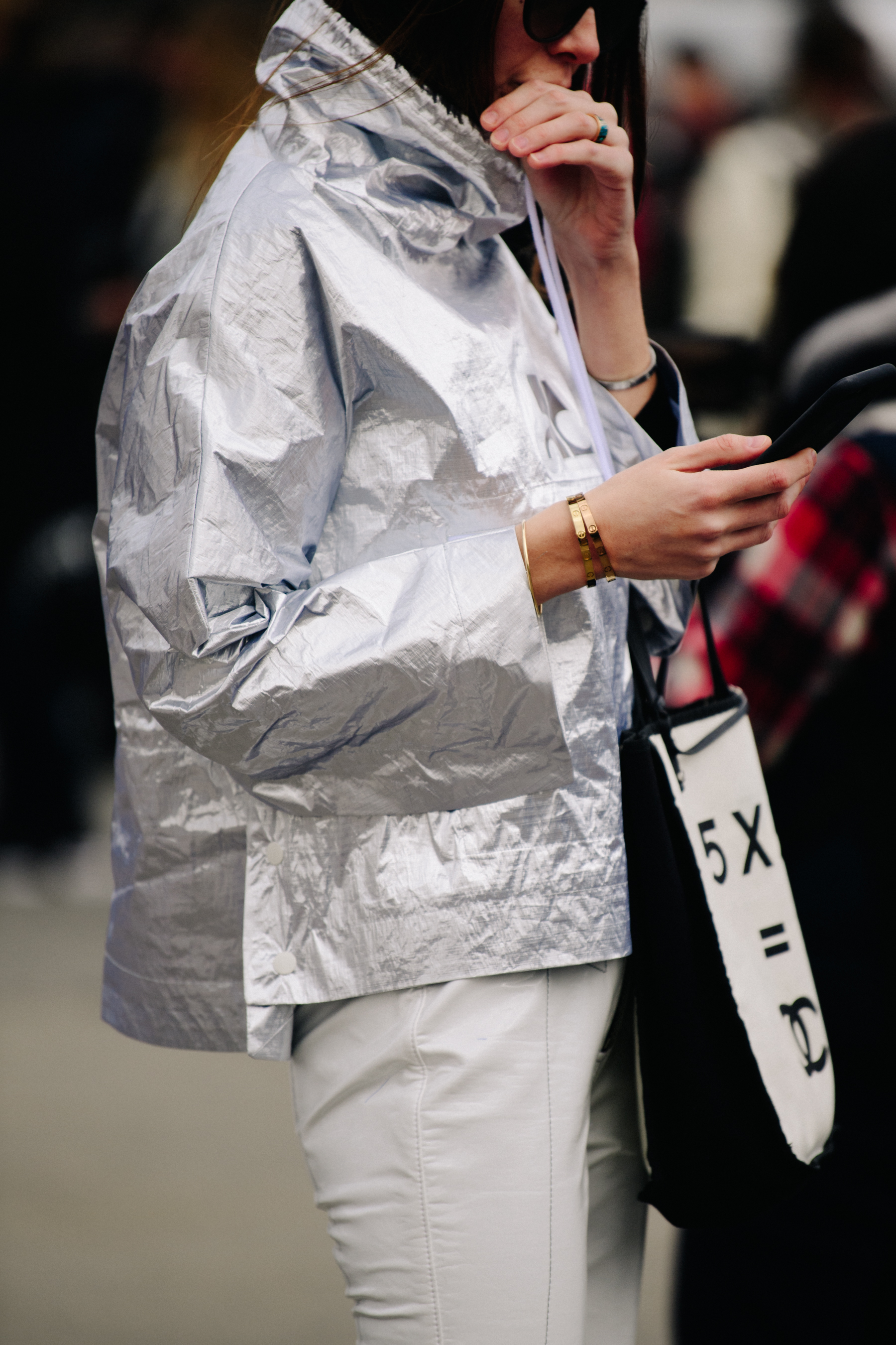 Woman wearing silver jacket