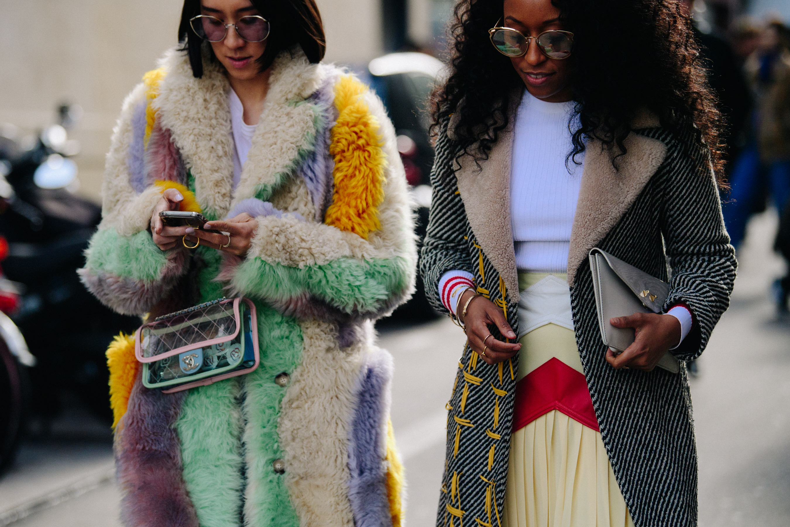 Two women wearing colourful outfits