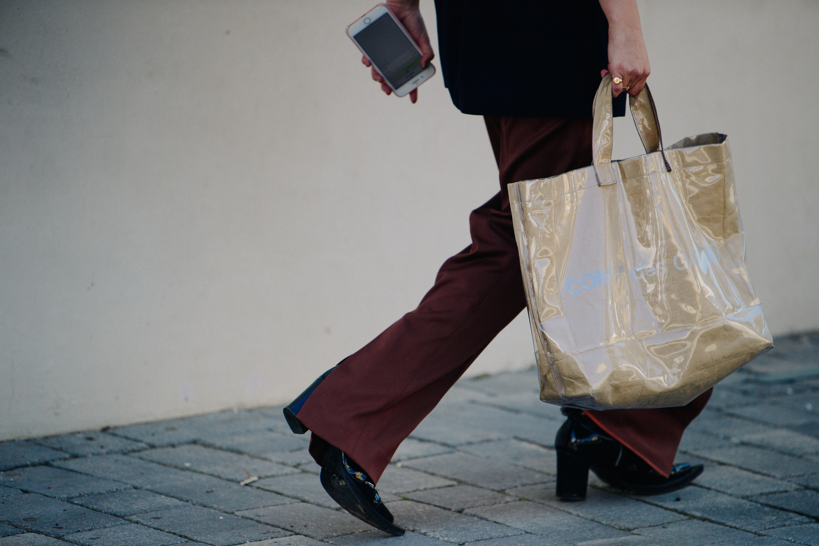 Woman carrying brown bag