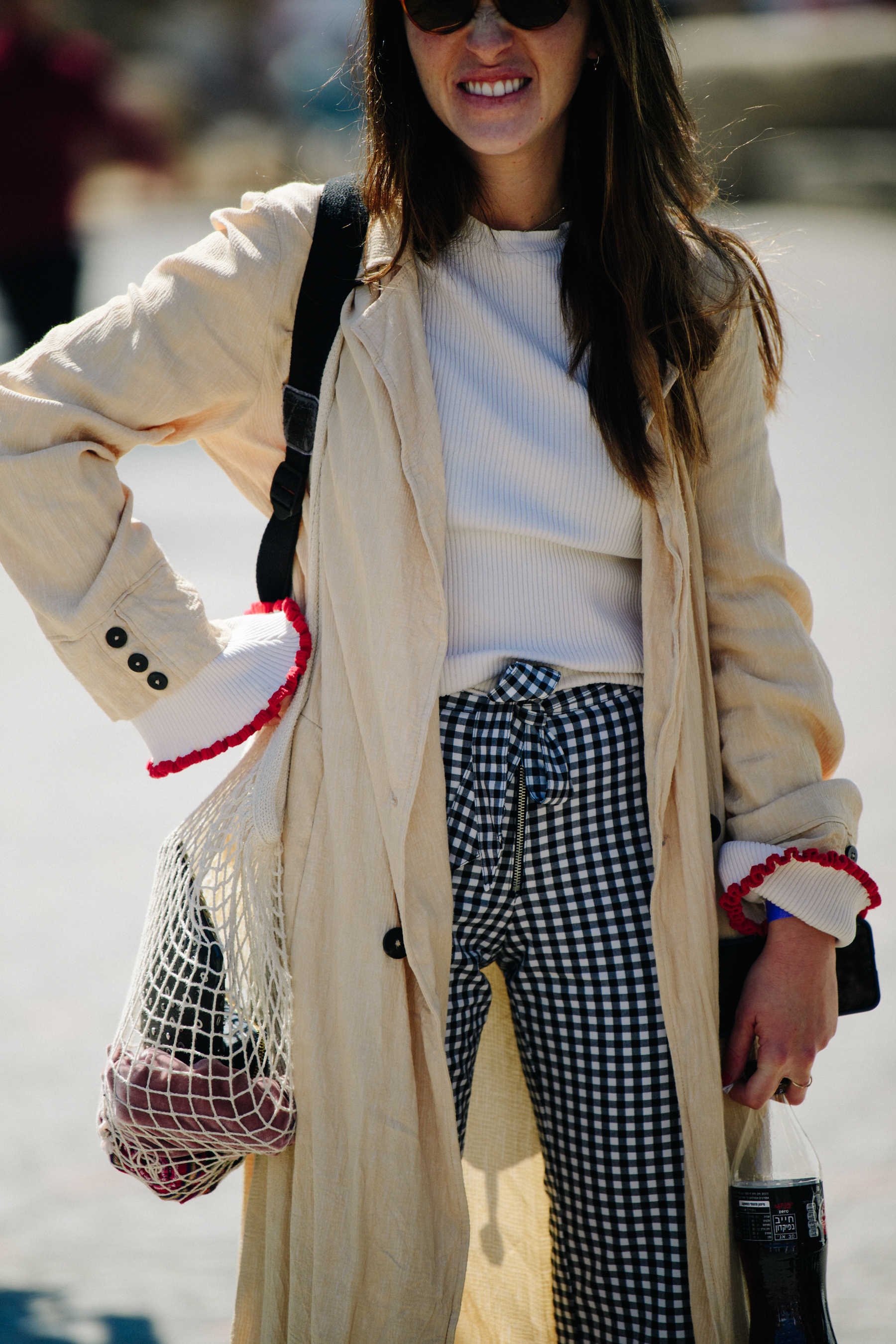 Woman wearing light tan coat