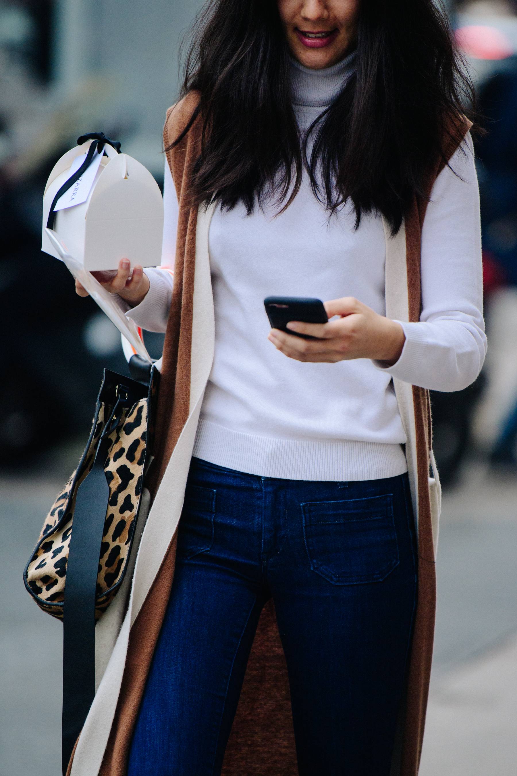 Woman wearing white jumper