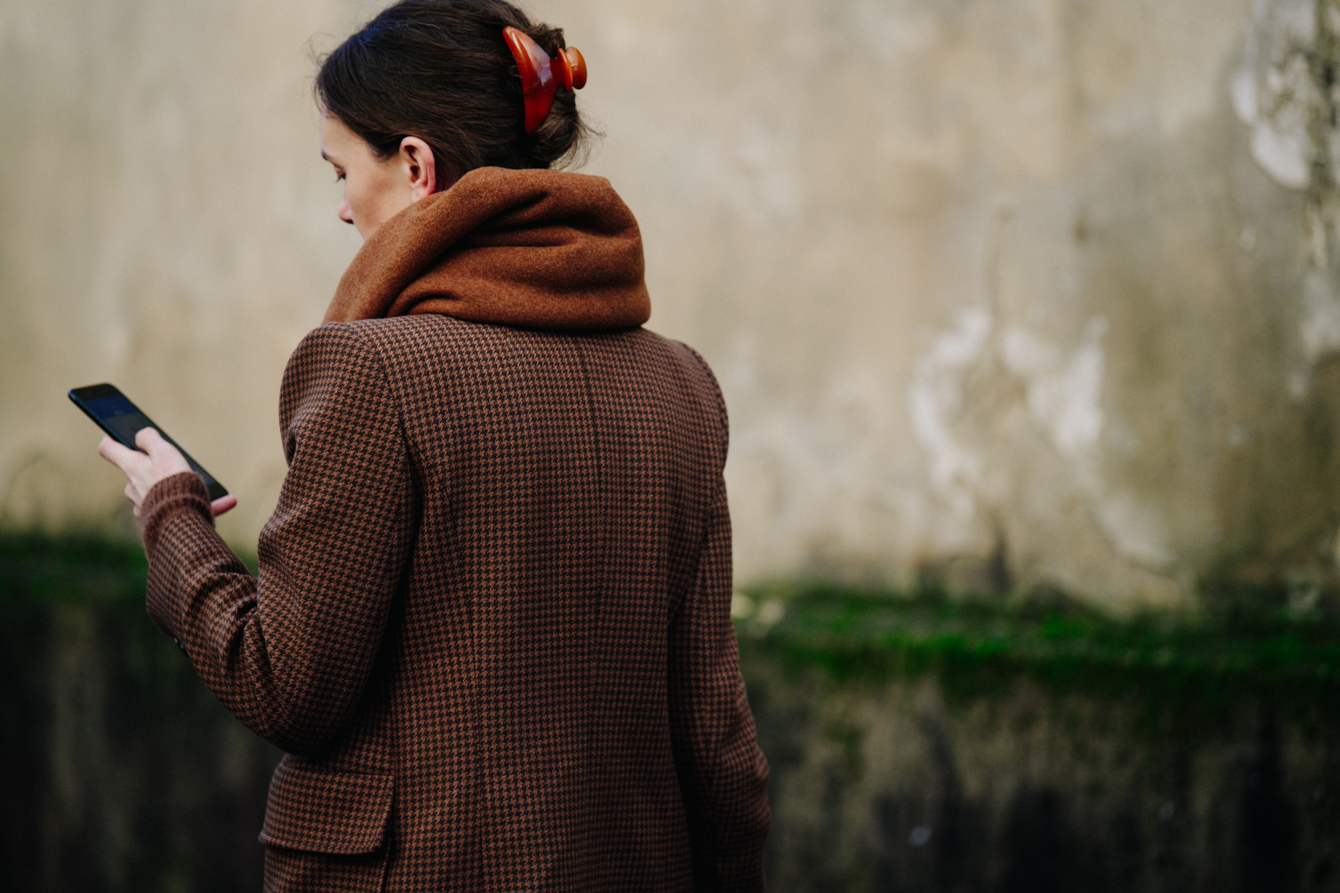Woman wearing brown scarf and jacket