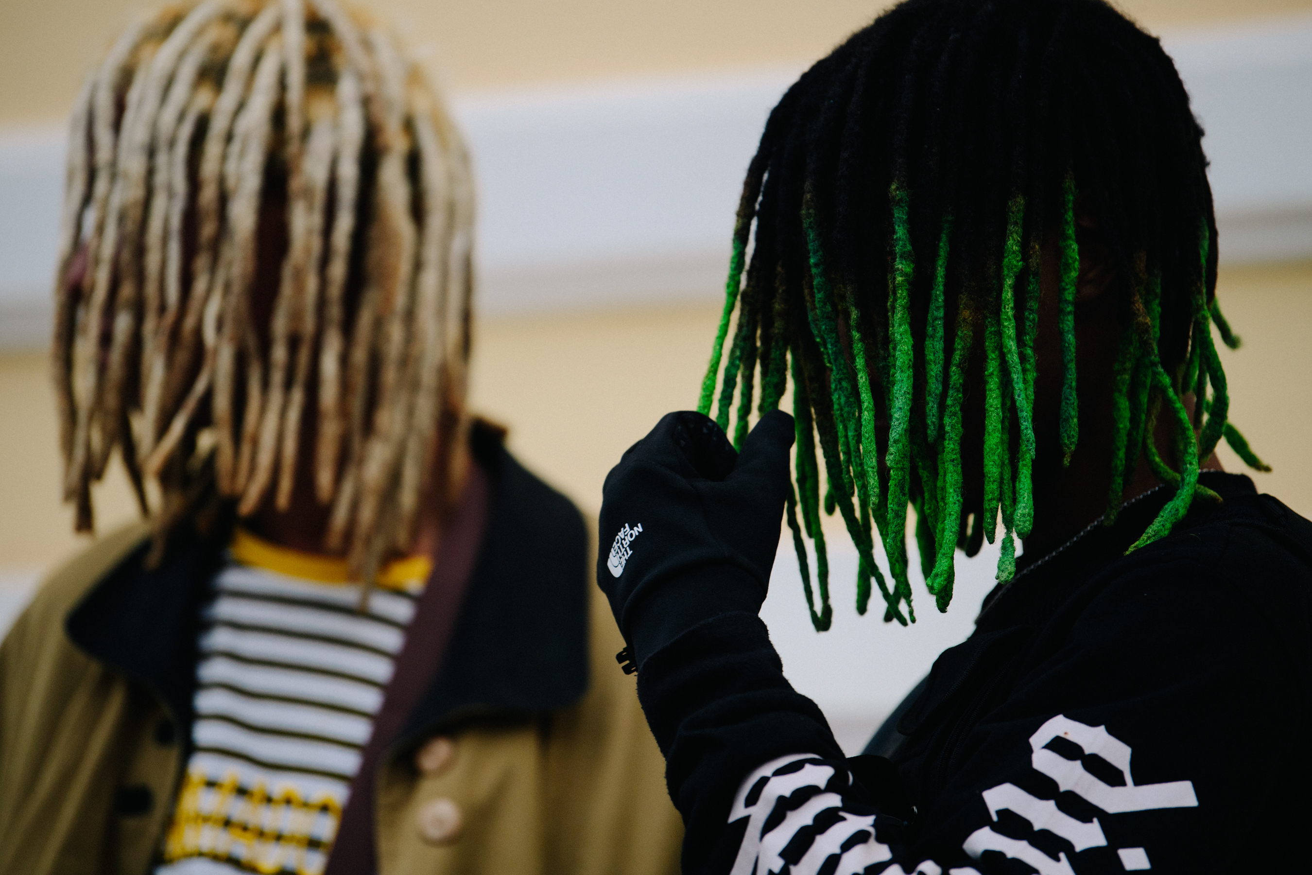 Two men with coloured dreadlocks