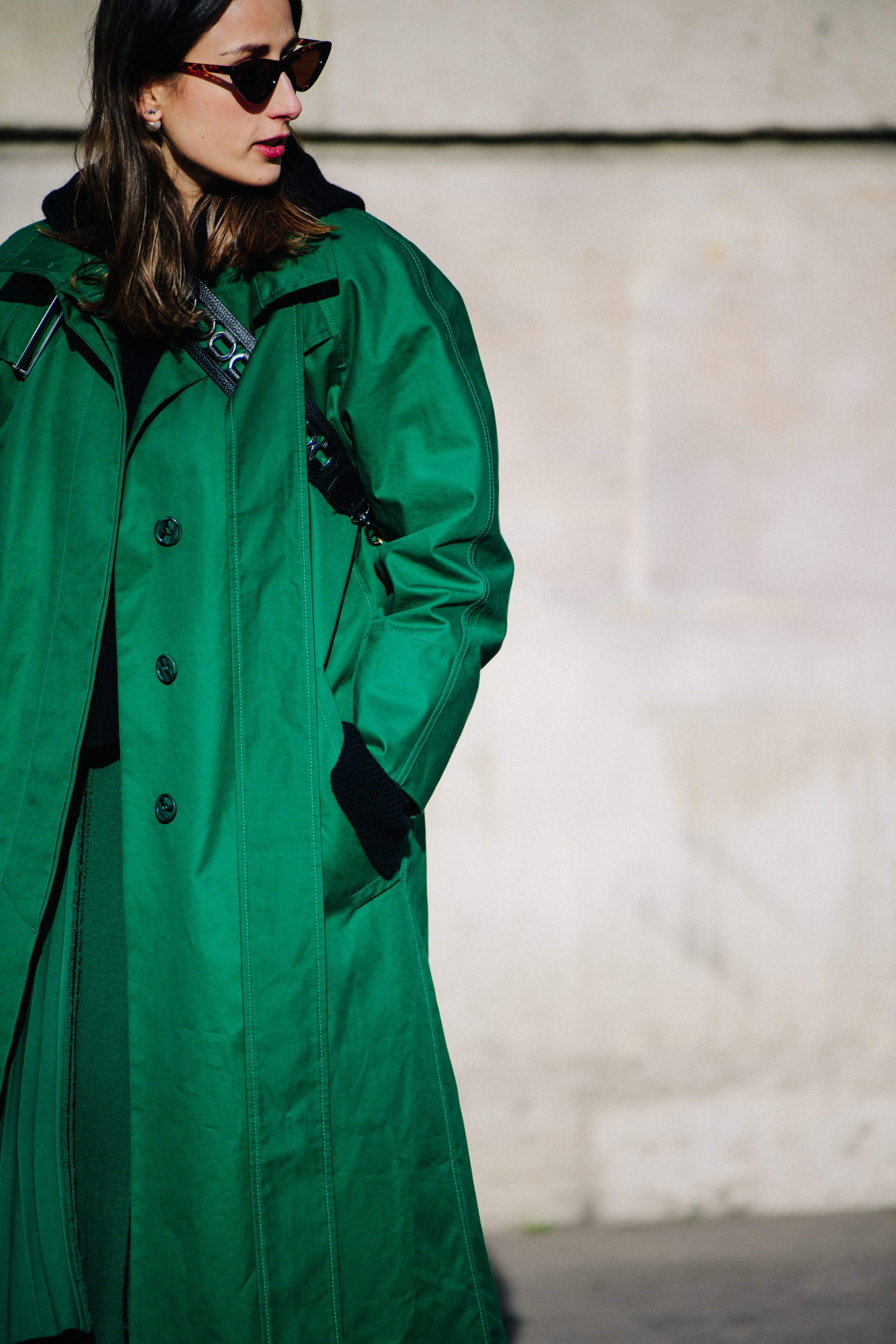 Woman wearing long green coat