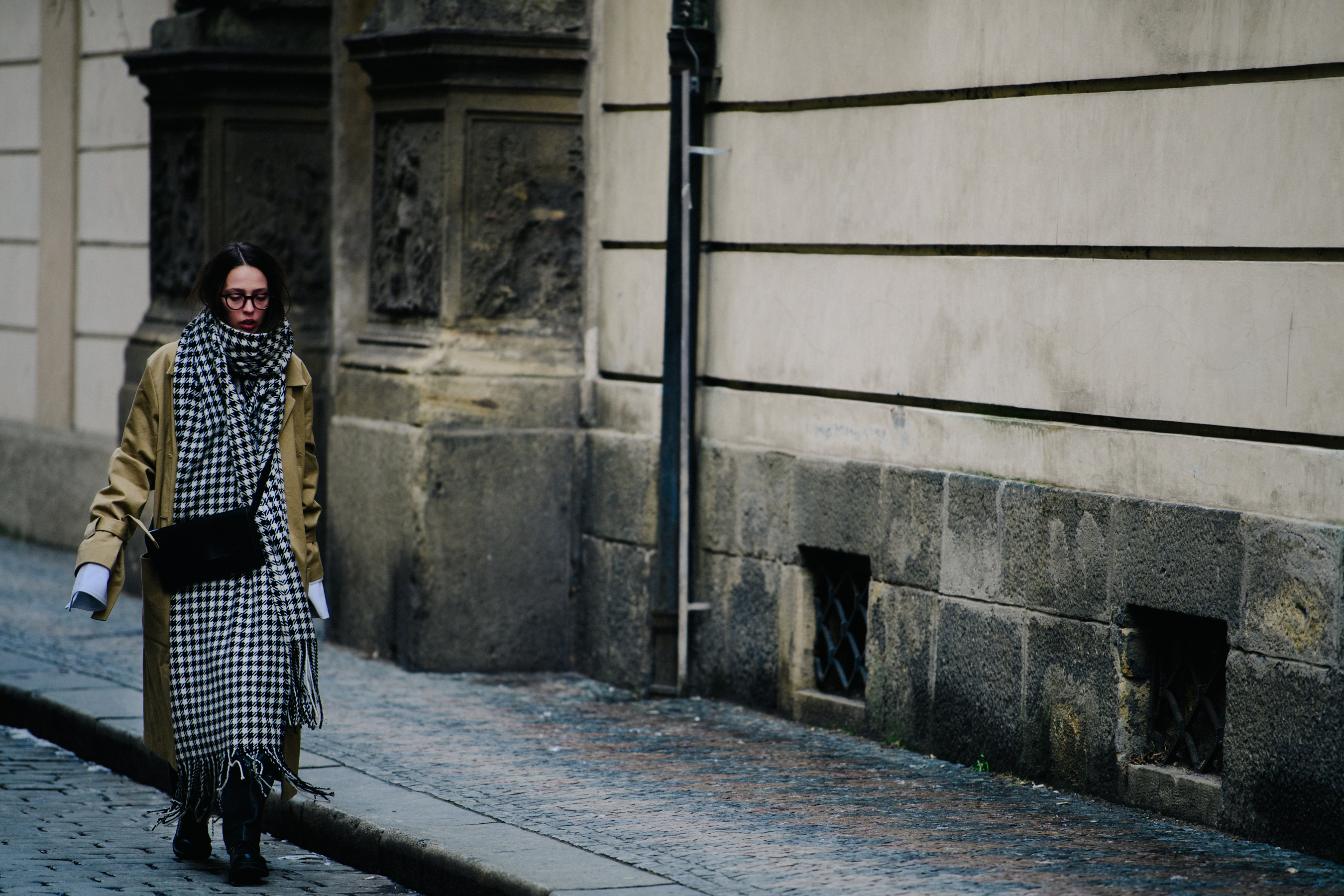 Woman wearing long check scarf