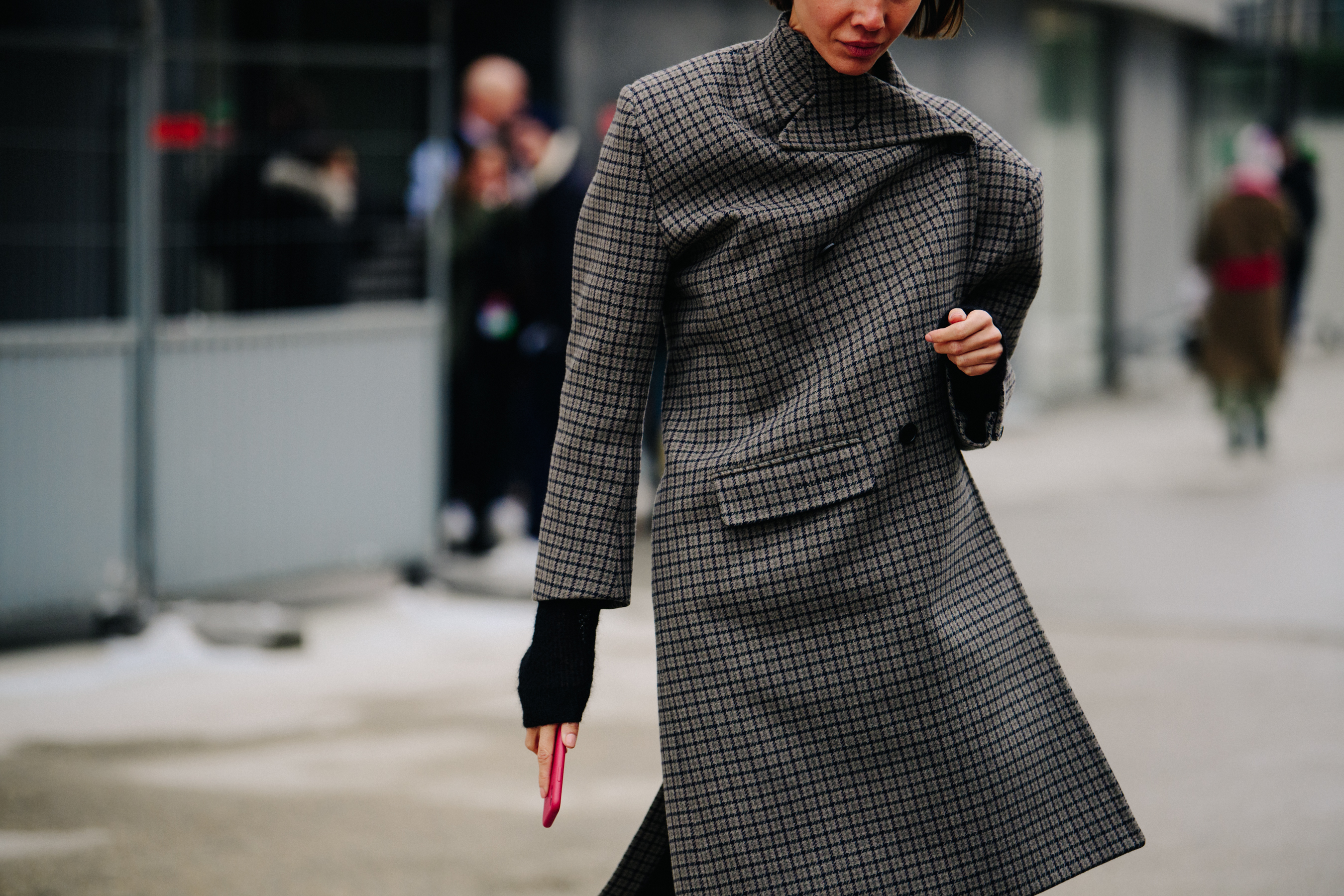 Woman wearing long grey coat