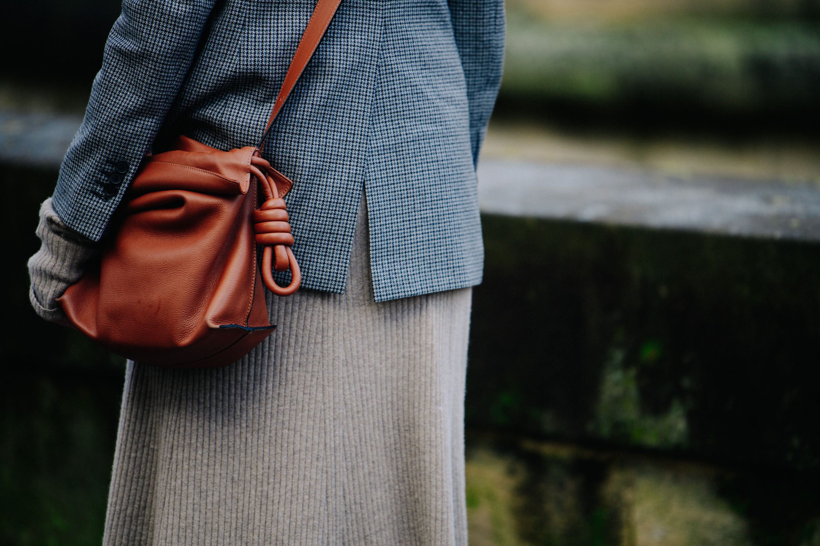 Woman carrying brown leather bag