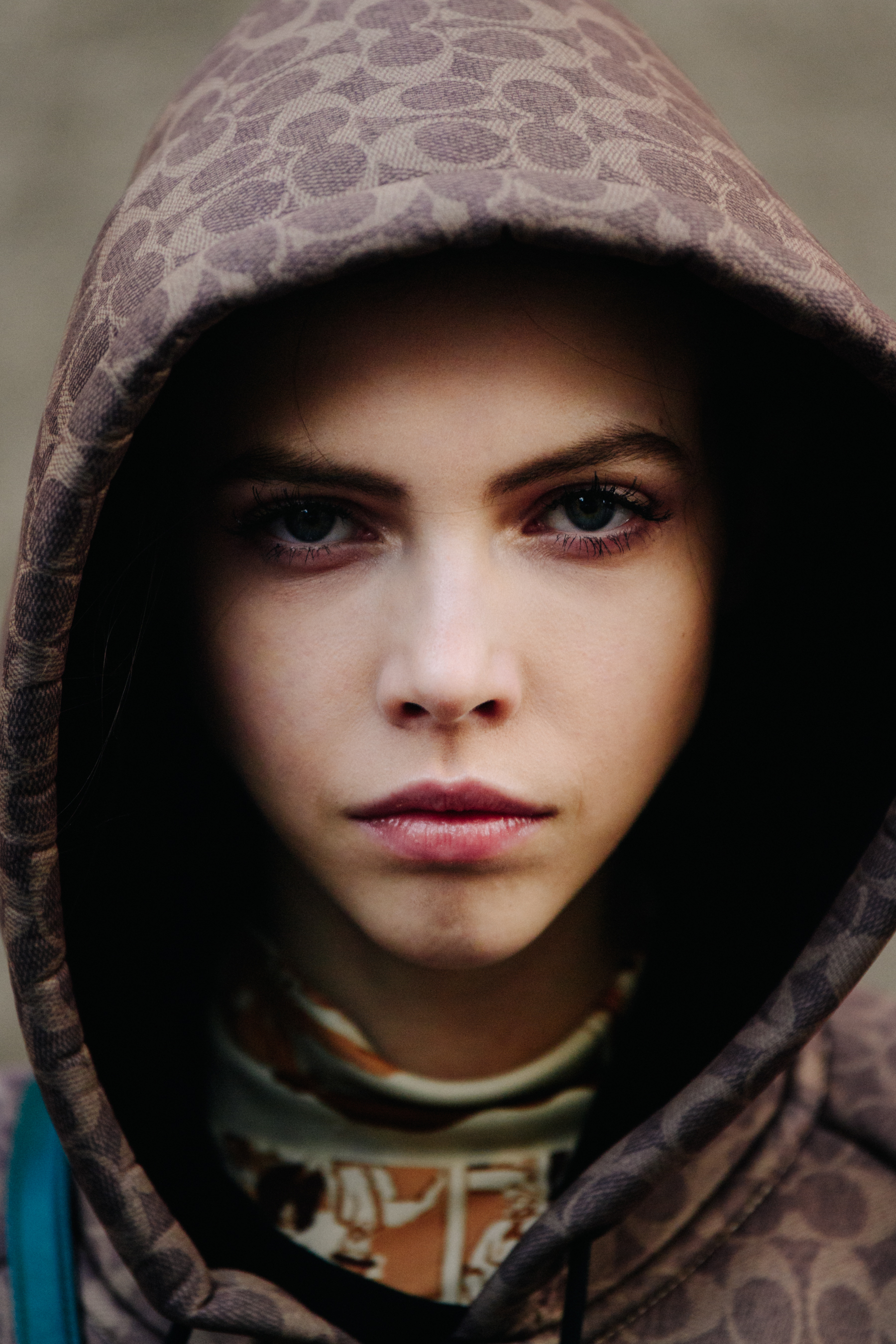 Portrait of model wearing brown hoodie