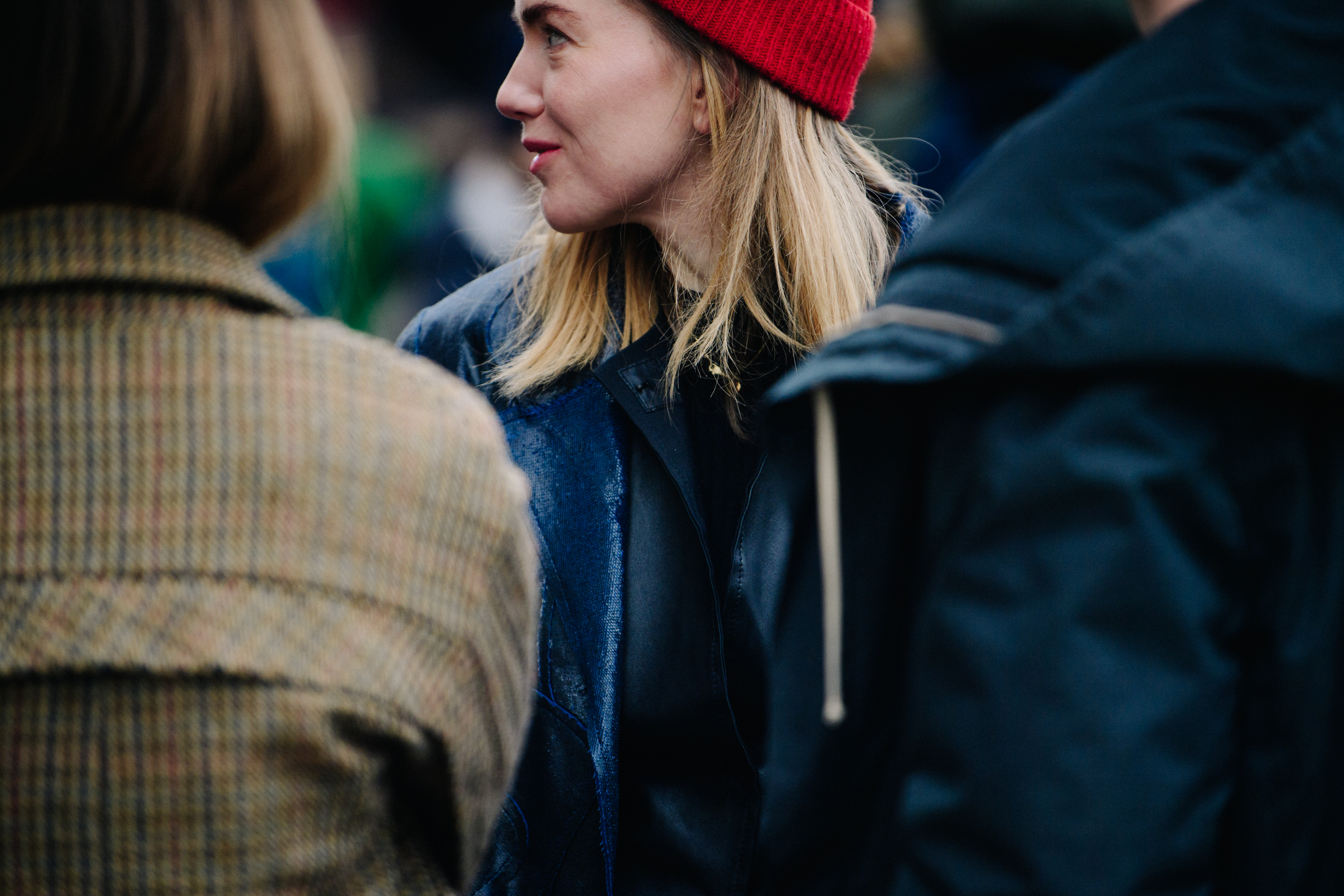 Woman wearing red beanie hat