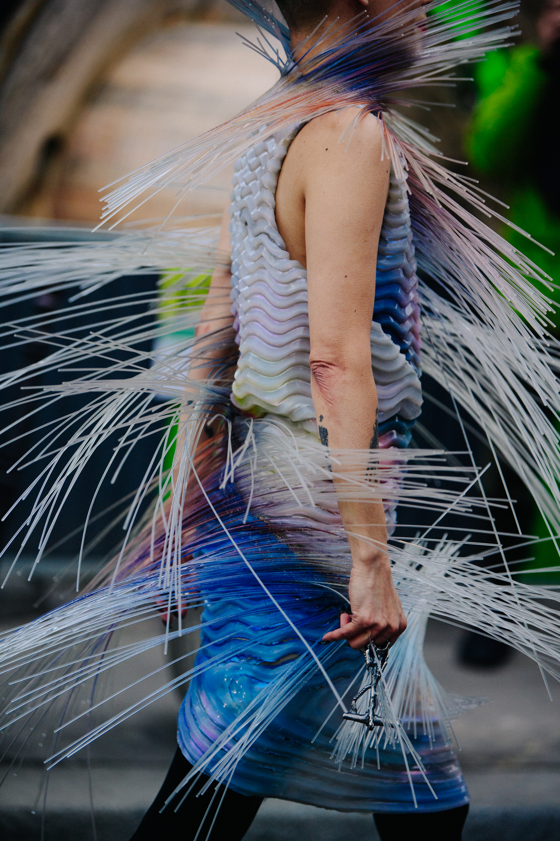 Woman wearing colourful plastic dress