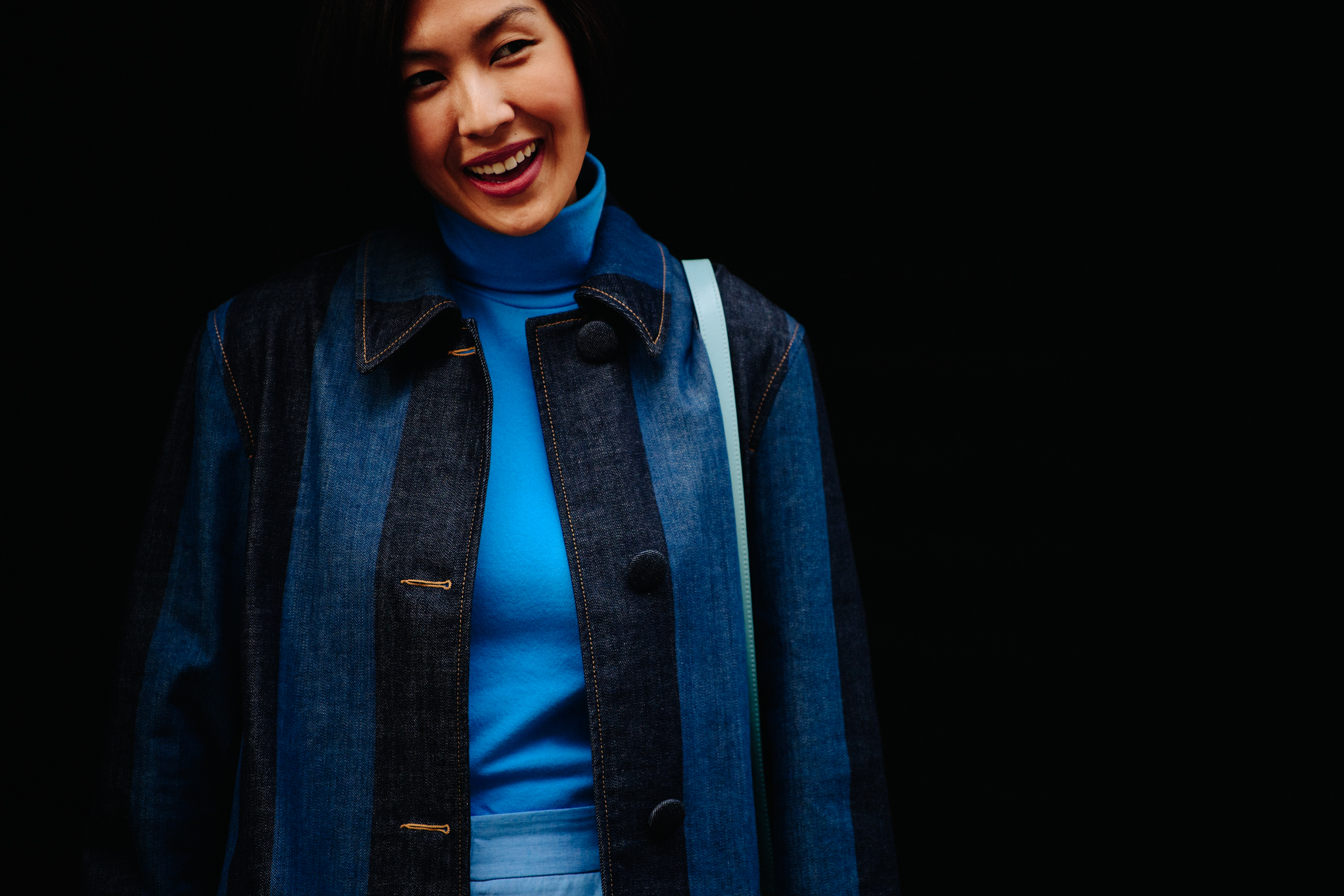 Asian woman wearing blue and black denim