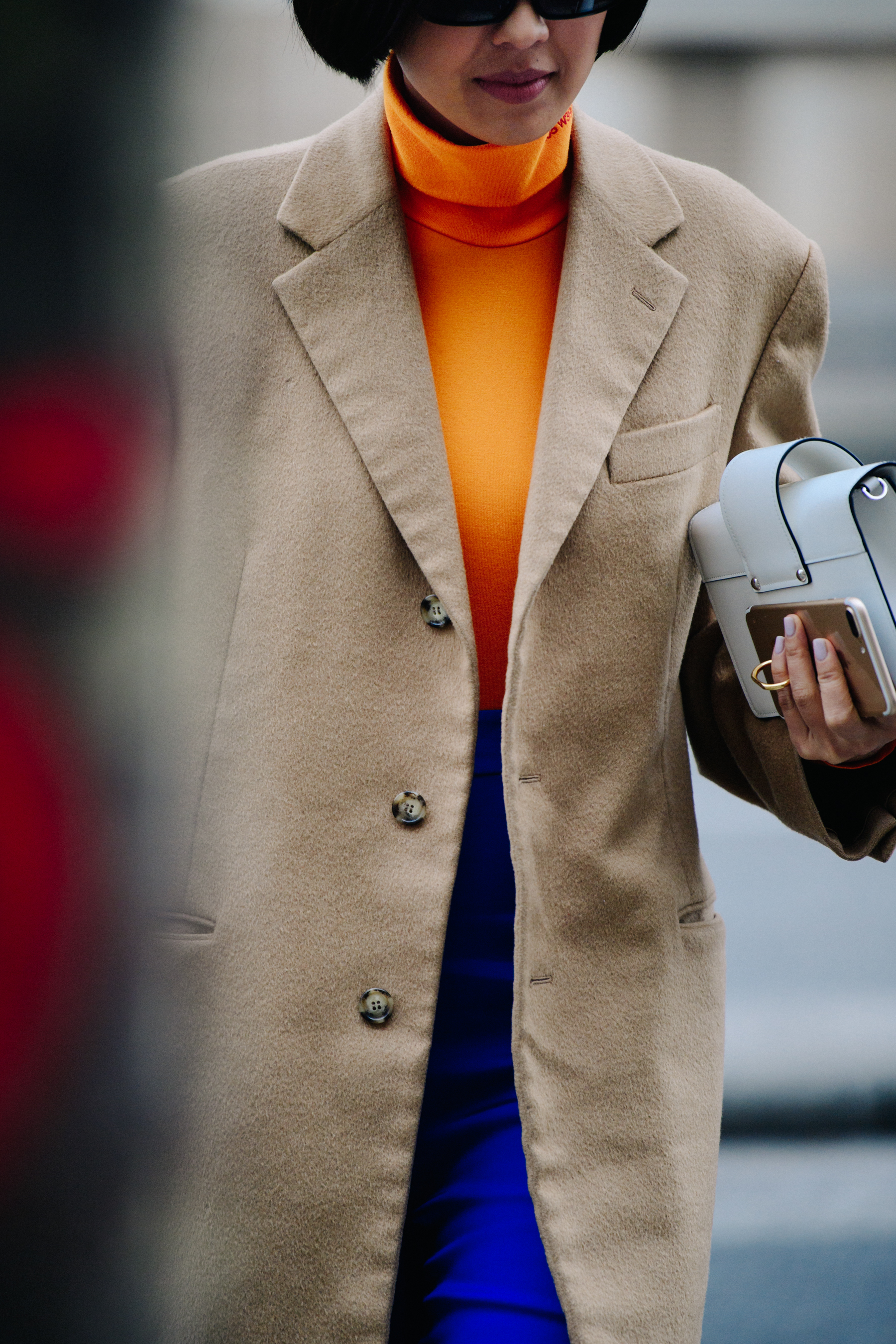 Asian woman wearing tan wool coat