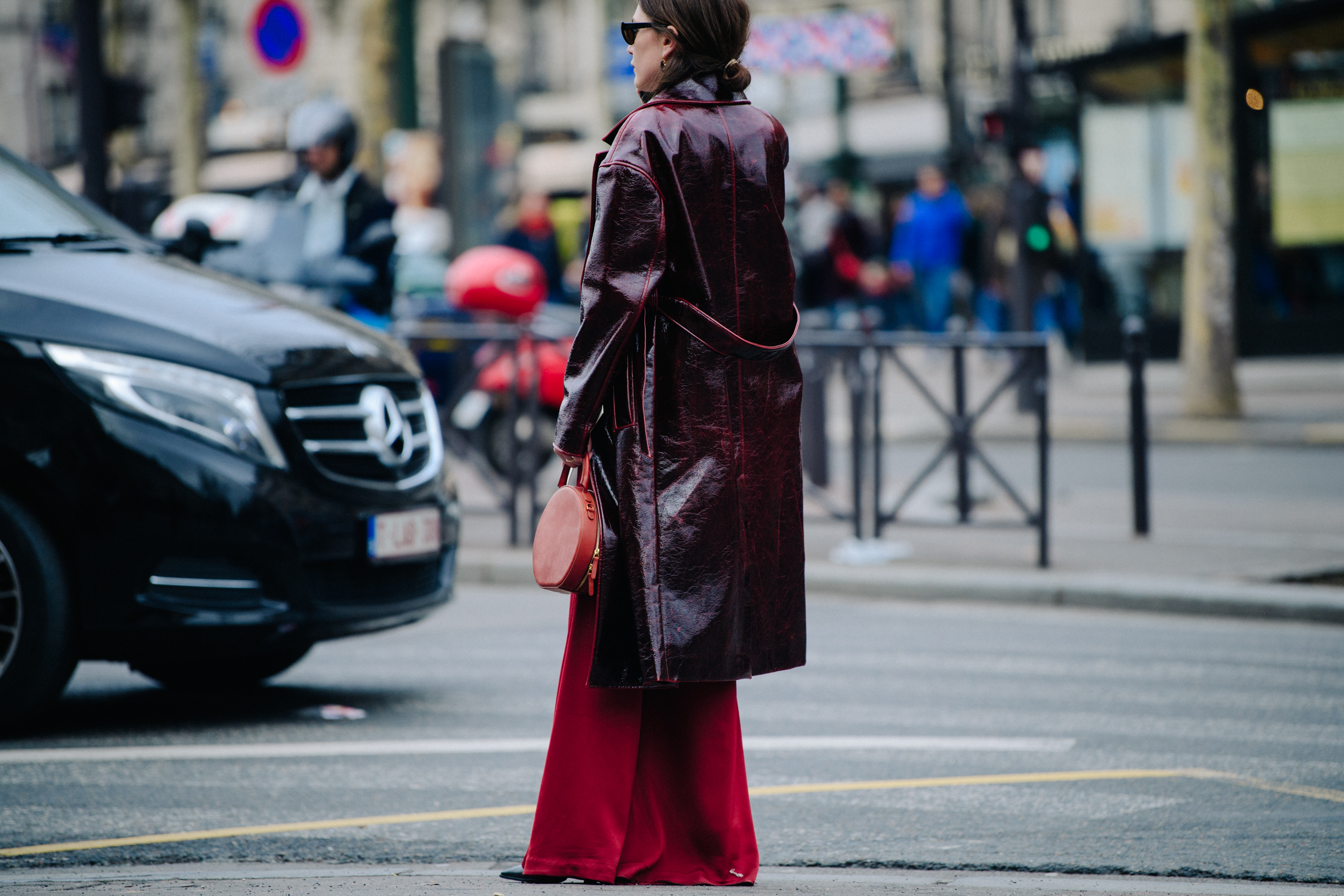 Woman wearing red leather coat