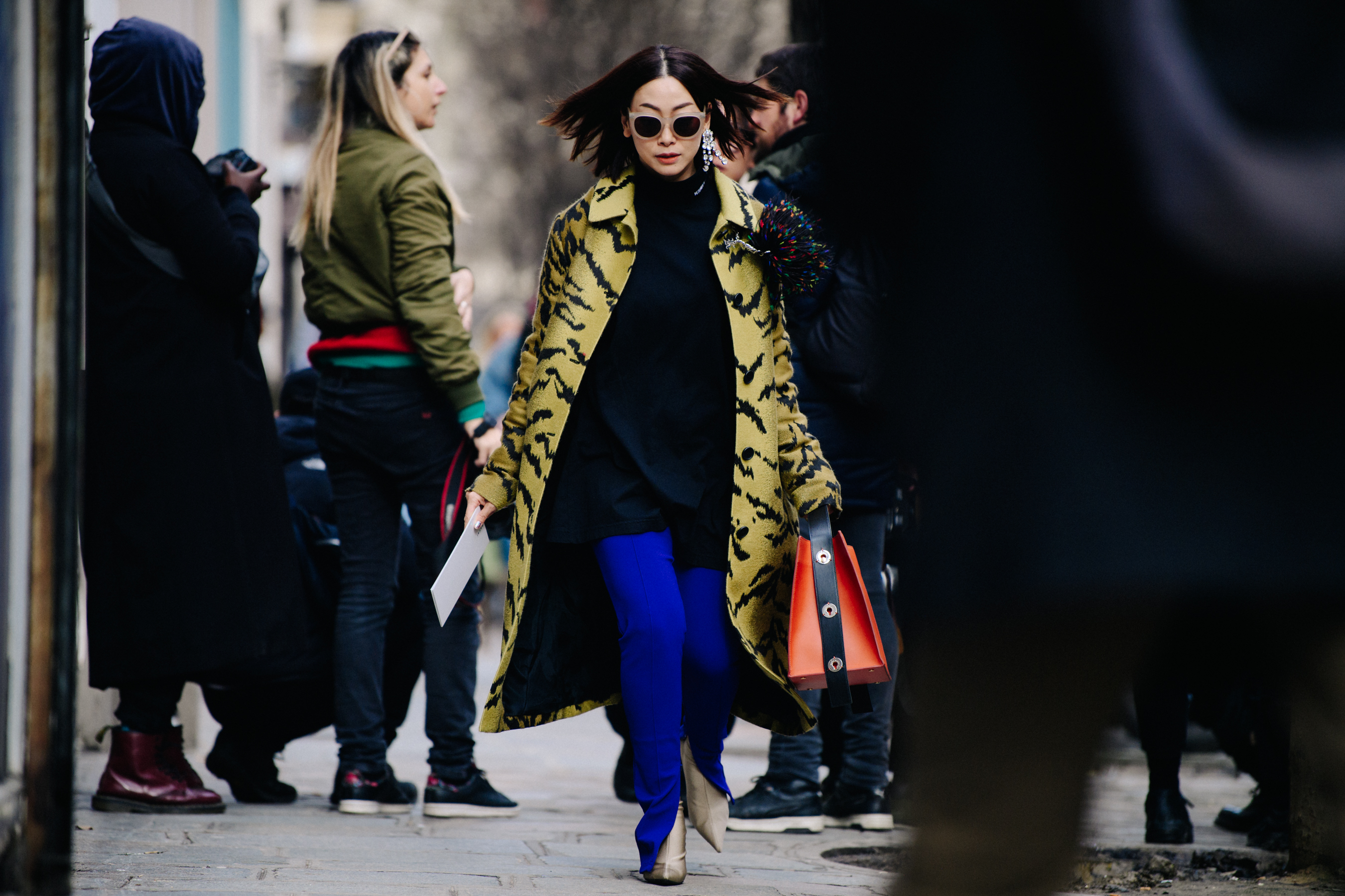 Asian woman wearing yellow coat