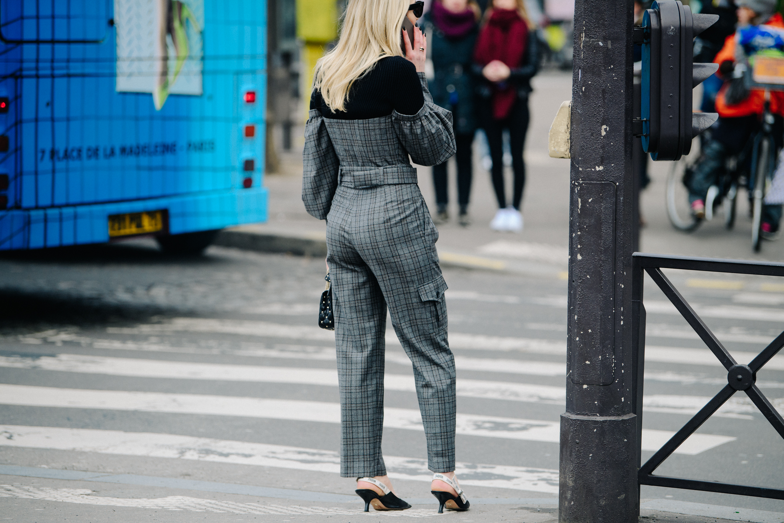 Woman wearing grey check suit