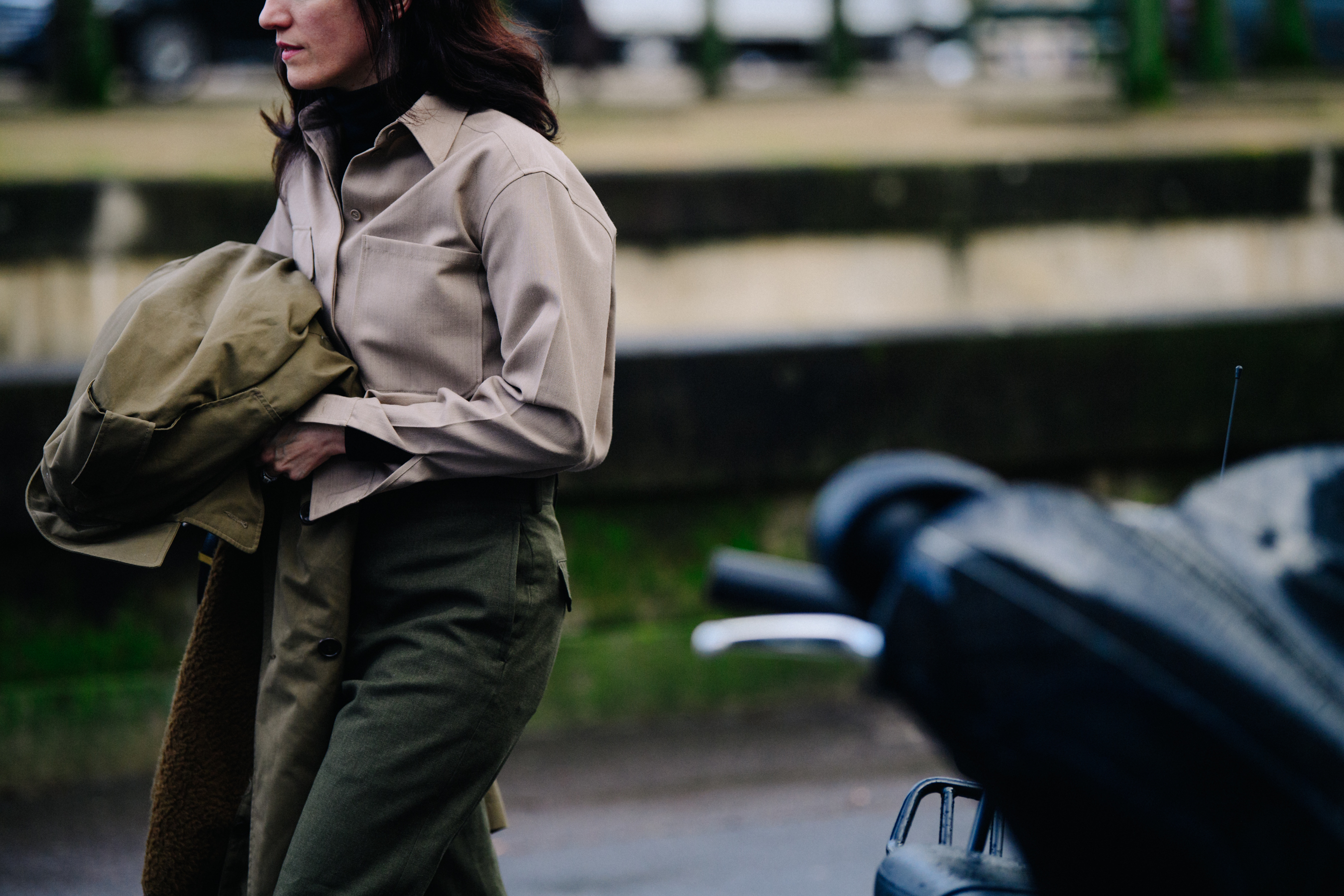 Woman wearing green pants and jacket